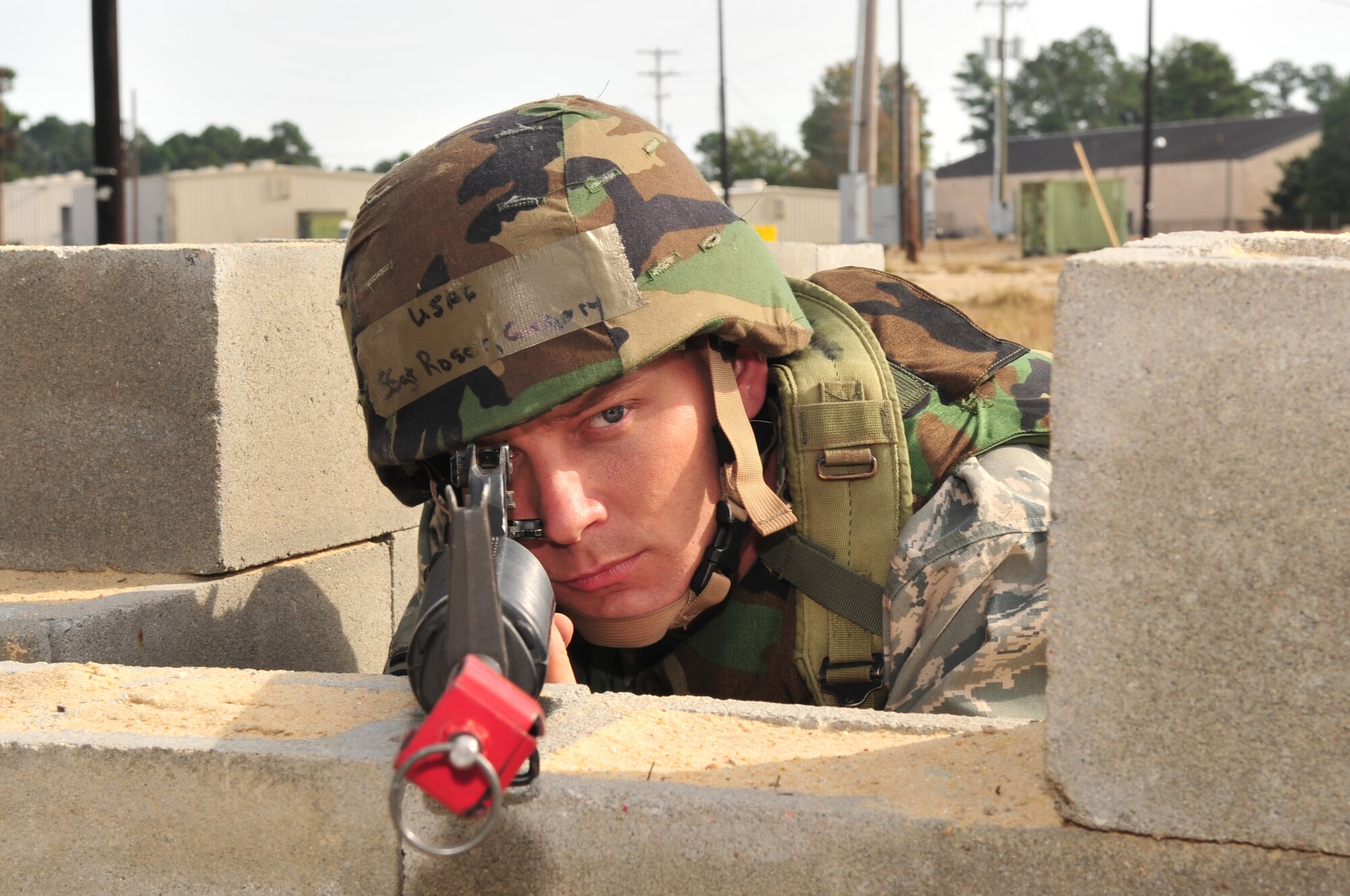 Staff Sgt. Gregory Rosar, 4th Civil Engineer Squadron utilities systems journeyman, monitors his area of responsibility during a field training exercise at Seymour Johnson Air Force Base, N.C., Oct. 22, 2009. The training scenarios involved dealing with combatants, curious natives and medical emergencies. (U.S. Air Force photo/Airman 1st Class Rae Perry)