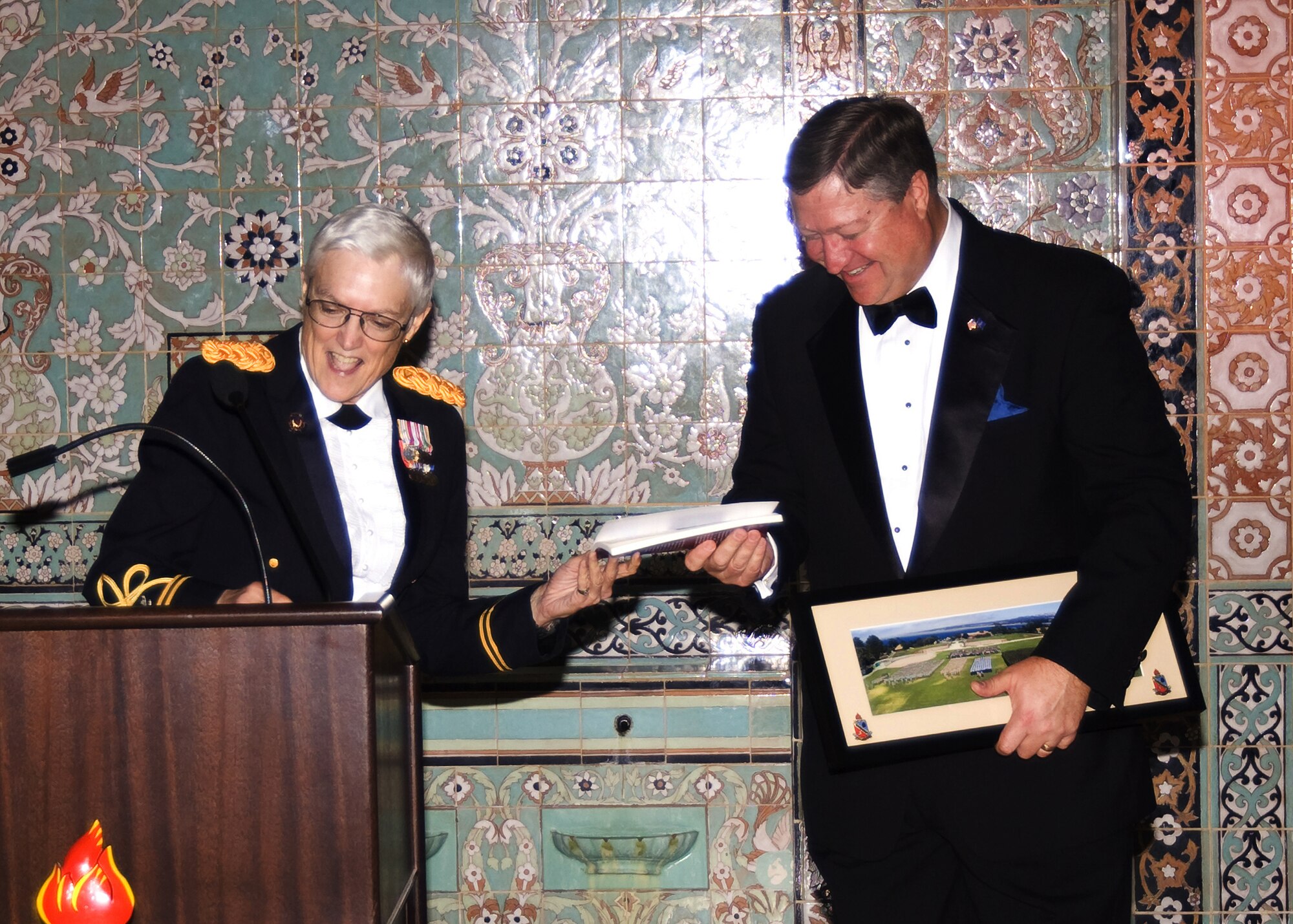 Col. Sue Ann Sandusky, Defense Language Institute Commandant, presents appreciation gifts to the Honorable Michael Donley, Secretary of the Air Force, following keynote speech at the Defense Language Institute Anniversary Ball, Monterey, Calif. on Oct. 24. (U.S. Army Photo/Per Anderson) 