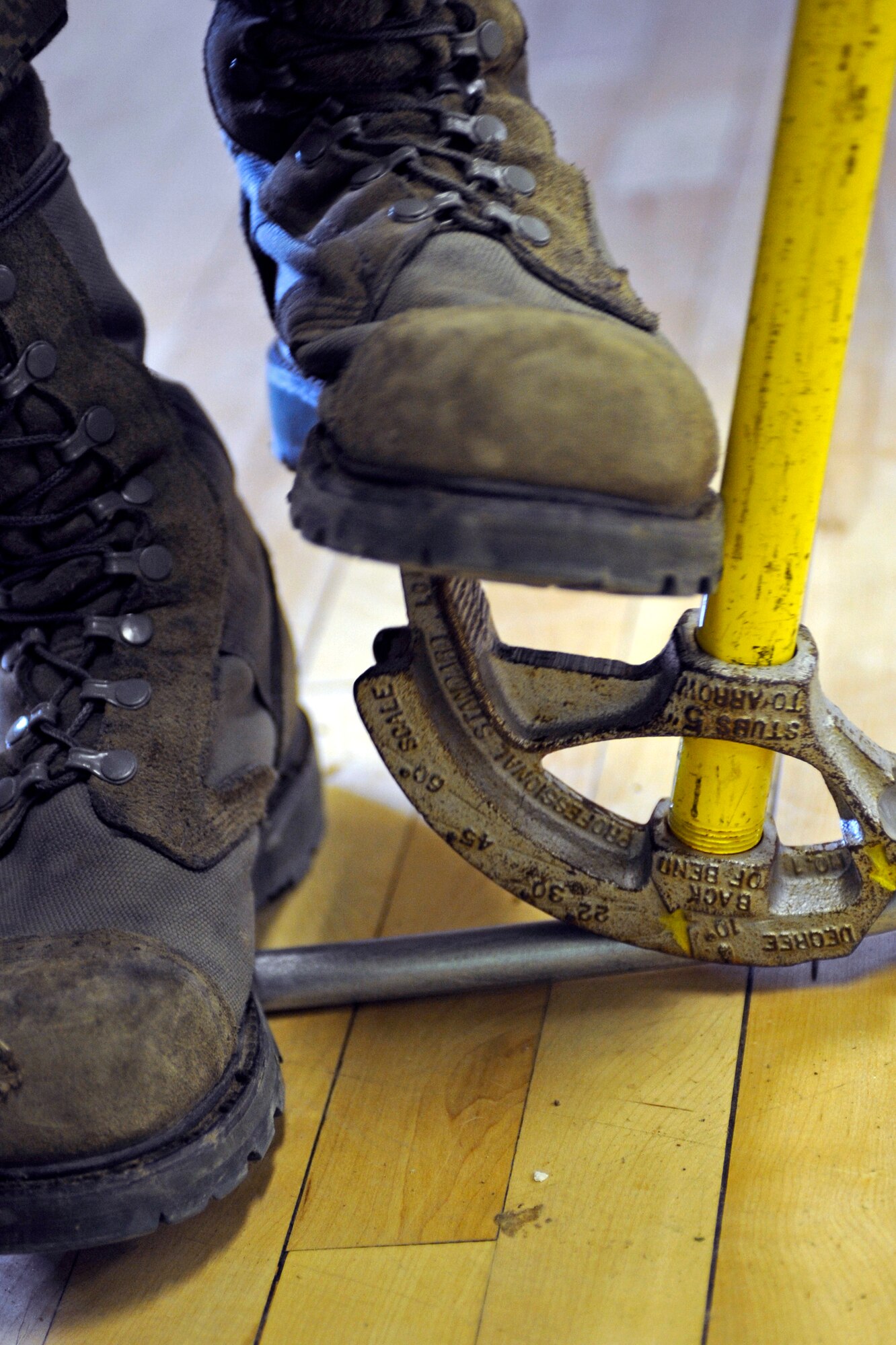 Airman Daniel Cordova, 28th Civil Engineer Squadron electrical systems technician, bends a pipe to a 90-degree angle here, Oct. 22. Airman Cordova is making a conduit to run power to a back room at the youth center. (U.S. Air Force photo/Airman 1st Class Matthew Flynn)