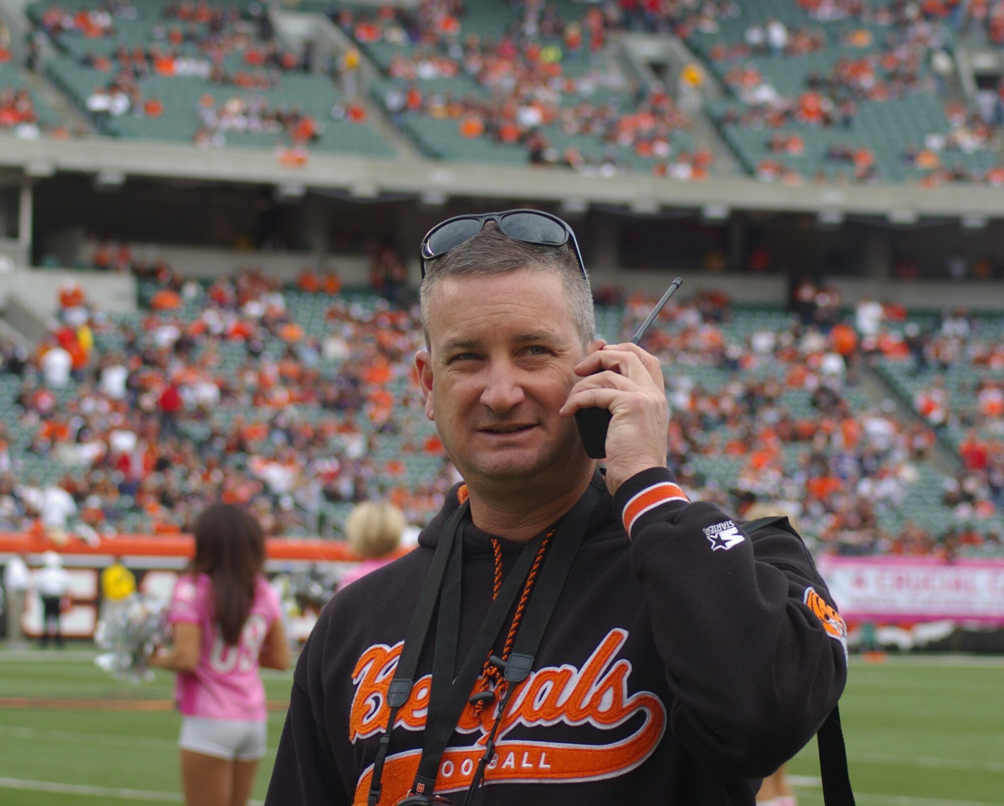 WRIGHT-PATTERSON AIR FORCE BASE, Ohio – Master Sgt. Jonathan Winters, 89th Airlift Squadron, talks to Lt. Col. Mike Baker, 445th Operational Support Squadron, about pre-game activities on the field prior to the Cincinnati Bengals vs. Chicago Bears football game Oct. 25.  Sergeant Winters and Colonel Baker coordinated the unit’s C-5 Galaxy flyover that occurred at the end of the national anthem. (U. S. Air Force photo/Laura Darden)