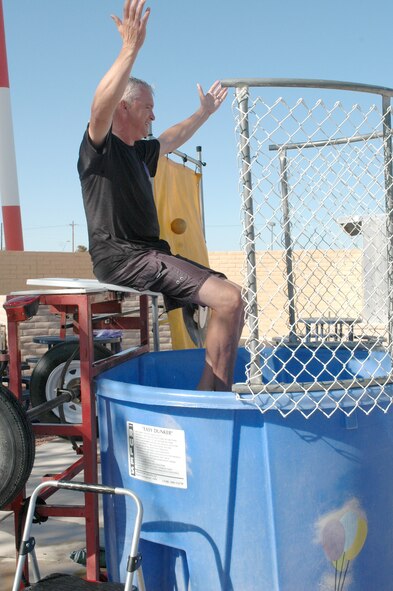 Col. Ted Maxwell, 162nd Fighter Wing vice commander, waits to be dropped into a dunk tank during the 162nd Fighter Wing’s Haunted Hangar, Oct. 25. Several wing leaders volunteered for the tank to raise funds for the Family Readiness Group. (Air National Guard photo by Maj. Gabe Johnson)