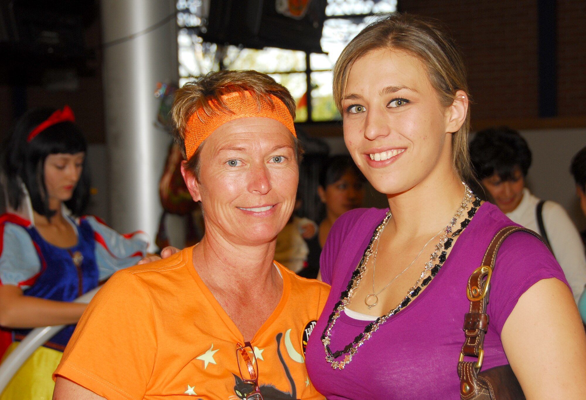 Barb Gavre, left, wing family readiness coordinator, and her daughter Samantha Ithal, ensure wing members and their families have a good time at the Haunted Hangar event, Oct. 25. The Family Readiness Group organizes the annual event to raise funds for several of the wing’s family programs. (Air National Guard photo by Master Sgt. David Neve)