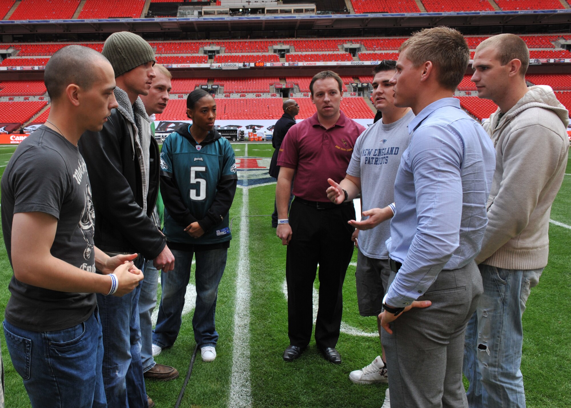 Army Sgt. Derick Pierce, Marine Corps Sgt. Tyler Gray, Air Force Senior Airman Roy Davis, Navy Petty Officer 1st Class DeMitra Pittman discuss movements with their British counterparts , Royal Air Force Rodi Murgitroyd, Army Lance Bombardier Steve Trayner Royal Marine David Jones and Able Seaman Richard Tomes just a few hours before the game.  (Photo by Air Force Staff Sgt. Javier Cruz)