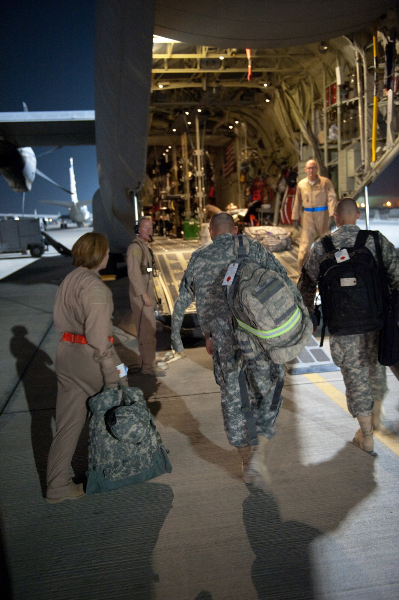 Airmen with the 379th Expeditionary Aeromedical Evacuation Squadron help patients board a C-130J Hercules in preparation for a regularly scheduled aeromedical evacuation mission, Oct. 24, 2009, in Southwest Asia. The 379 EAES provides a routine "mercy mission" that transports patients from throughout Southwest Asia to established medical care facilities in support of operations Iraqi Freedom and Enduring Freedom. (U.S. Air Force photo/Staff Sgt. Robert Barney)