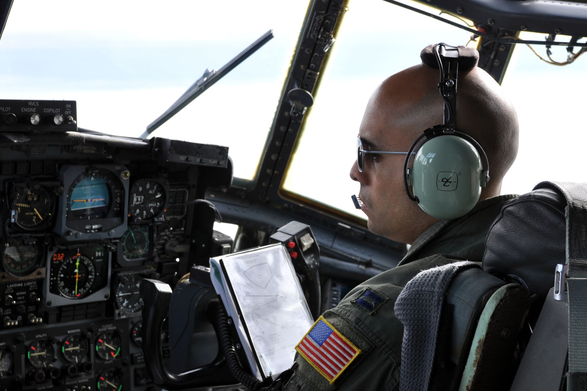 SOMEHWERE OVER GERMANY -- Air Force Reserve Capt. Peter Chand checks the flight instruments on the control panel of a C-130H Hercules tactical cargo transport aircraft, asssigned to the 910th Airlift Wing based at Youngstown Air Reserve Station, Ohio, moments after taking off from Ramstein Air Base, Germany, October 22, 2009. Captain Chand, co-pilot on this aircraft, and eight other Citizen Airmen from YARS are on an airlift mission delivering passengers and cargo to the country of Moldova, located in eastern Europe between Romania and the Ukraine. The aircrew members participating in this airlift mission are among more than 70 Servicemembers from the 910th AW attached to the 38th Expeditionary Airlift Squadron, based here. The 38th EAS is supporting Operation Joint Enterprise by providing tactical airlift capability to locations in the U.S. Europe Command (EUROCOM), U.S. Africa Command (AFRICOM) and U.S. Central Command (CENTCOM) theaters of operations. U.S. Air Force photo by Master Sgt. Bob Barko Jr.  