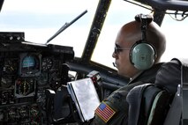 SOMEHWERE OVER GERMANY -- Air Force Reserve Capt. Peter Chand checks the flight instruments on the control panel of a C-130H Hercules tactical cargo transport aircraft, asssigned to the 910th Airlift Wing based at Youngstown Air Reserve Station, Ohio, moments after taking off from Ramstein Air Base, Germany, October 22, 2009. Captain Chand, co-pilot on this aircraft, and eight other Citizen Airmen from YARS are on an airlift mission delivering passengers and cargo to the country of Moldova, located in eastern Europe between Romania and the Ukraine. The aircrew members participating in this airlift mission are among more than 70 Servicemembers from the 910th AW attached to the 38th Expeditionary Airlift Squadron, based here. The 38th EAS is supporting Operation Joint Enterprise by providing tactical airlift capability to locations in the U.S. Europe Command (EUROCOM), U.S. Africa Command (AFRICOM) and U.S. Central Command (CENTCOM) theaters of operations. U.S. Air Force photo by Master Sgt. Bob Barko Jr.  