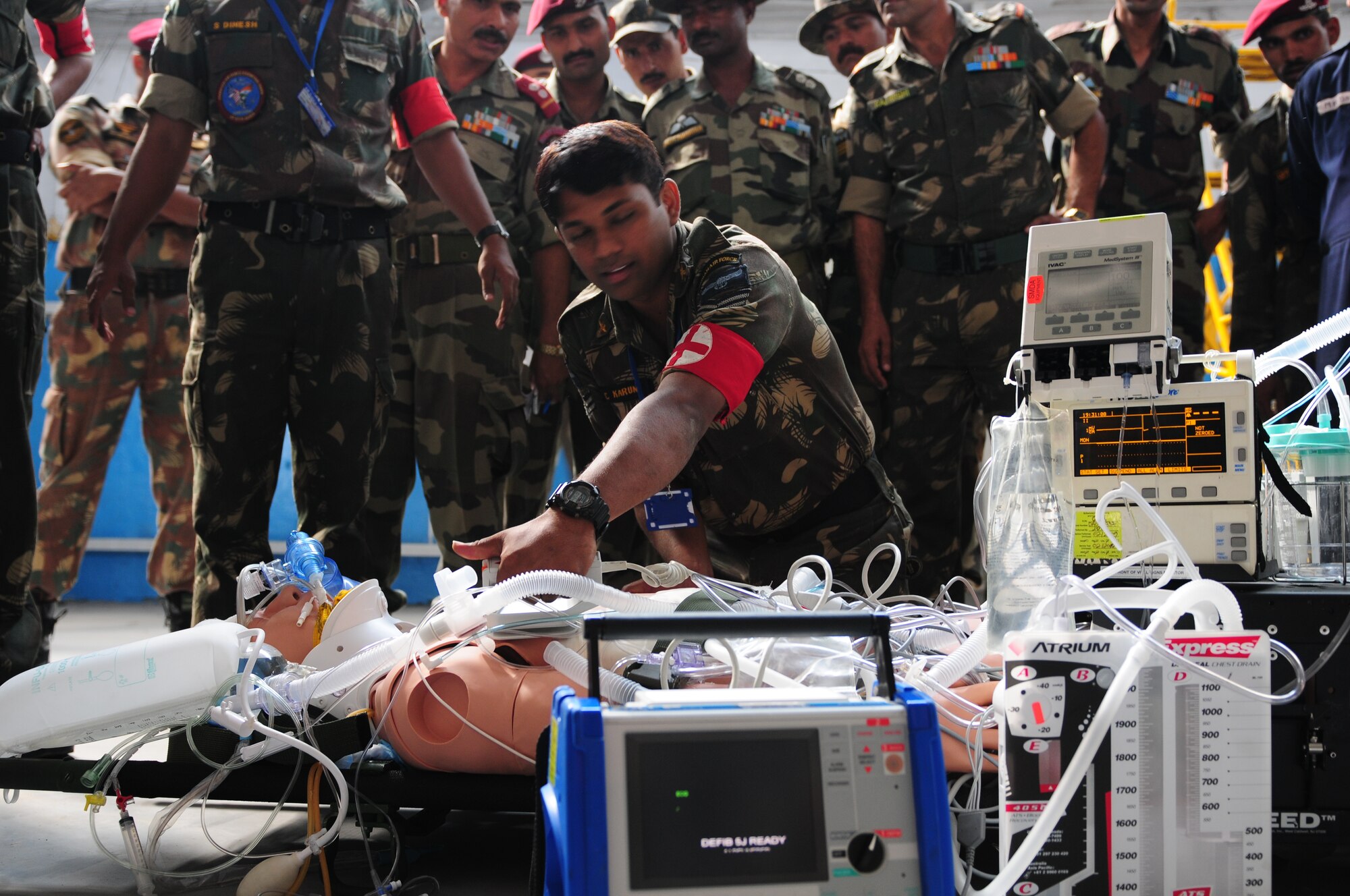 An Indian Air Force medic provides emergency response on a mannequin patient during a U.S. Air Force medical demonstration as part of exercise Cope India. Cope India is humanitarian assistance disaster relief exercise scheduled Oct. 19-23. (U.S. Air Force photo/Capt. Genieve David) 

