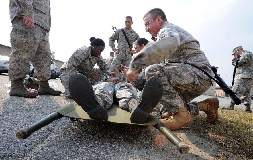 Airmen from the 51st Logistics Readiness Squadron perform Self-Aid-Buddy Care during the squadron’s pre-Operational Readiness Exercise training held here Oct. 15-16. (Air Force photo/Senior Airman Stephanie Wade)