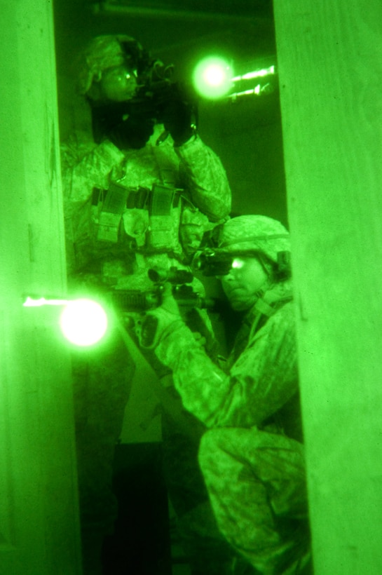 As seen through a night-vision device, U.S. Army paratroopers train using infrared lasers and night vision optics on Camp Ramadi, Iraq, Oct. 26, 2009.