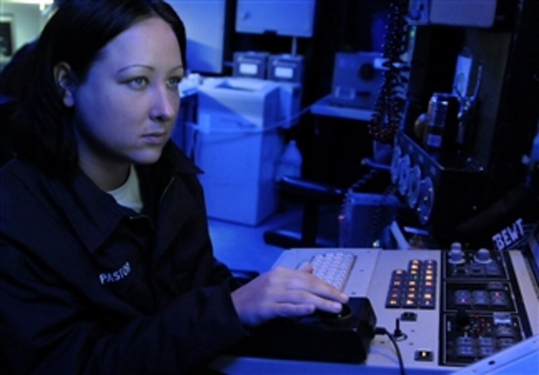 U.S. Navy Seaman Jennifer Pastor stands watch at the AN/SLQ-32 electronic warfare system in the combat information center aboard the 7th Fleet command ship USS Blue Ridge (LCC 19) underway in the Pacific Ocean on Oct. 19, 2009.  The Blue Ridge serves under Commander, Expeditionary Strike Group 7/Task Force 76, the Navy's only forward-deployed amphibious force, and is the flagship of Commander, U.S. 7th Fleet.  