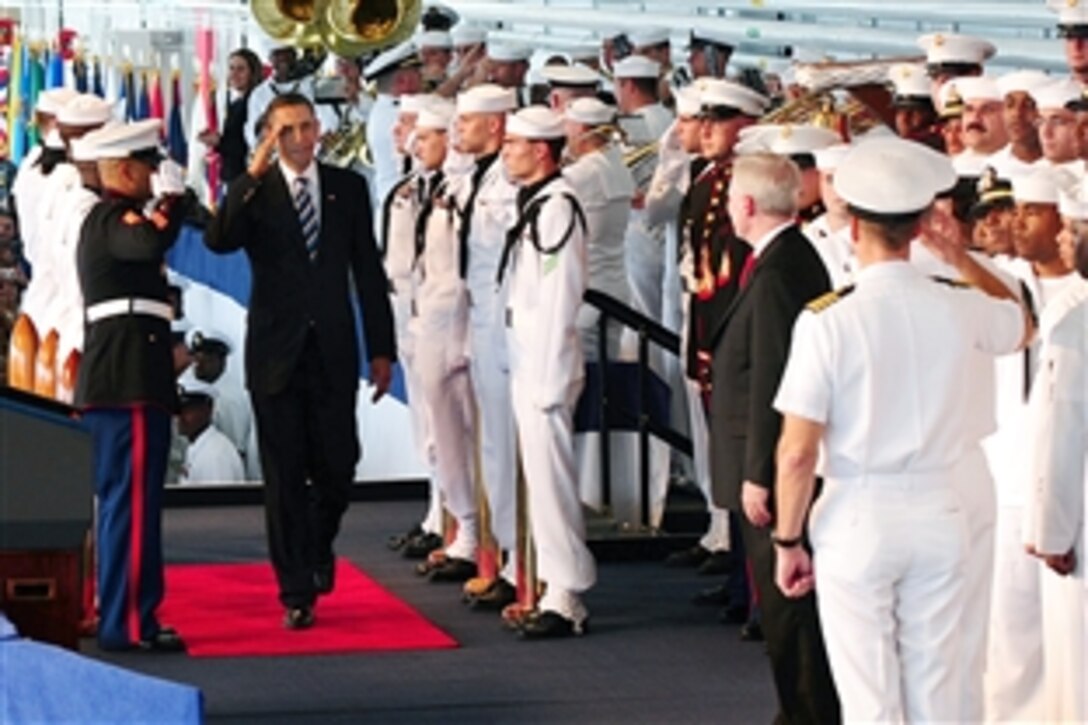 President Barack Obama receives official honors while arriving on board Naval Air Station Jacksonville, Fla., Oct. 26, 2009. A crowd of 3,500 sailors, Marines and other troops greeted the president.