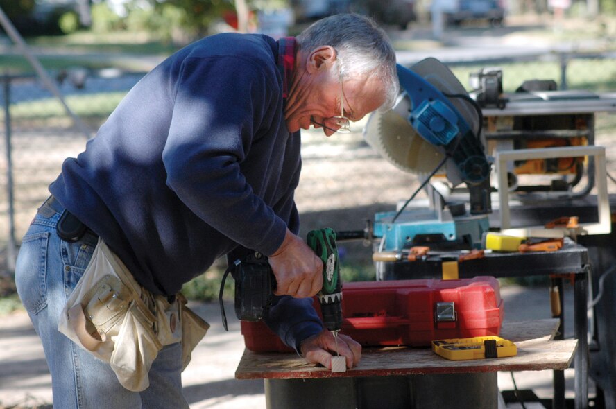 Brig. Gen. (ret) Jim Sehorn works on a project in the Gantt's yard during the renovation of the house. U. S. Air Force photo by Sue Sapp