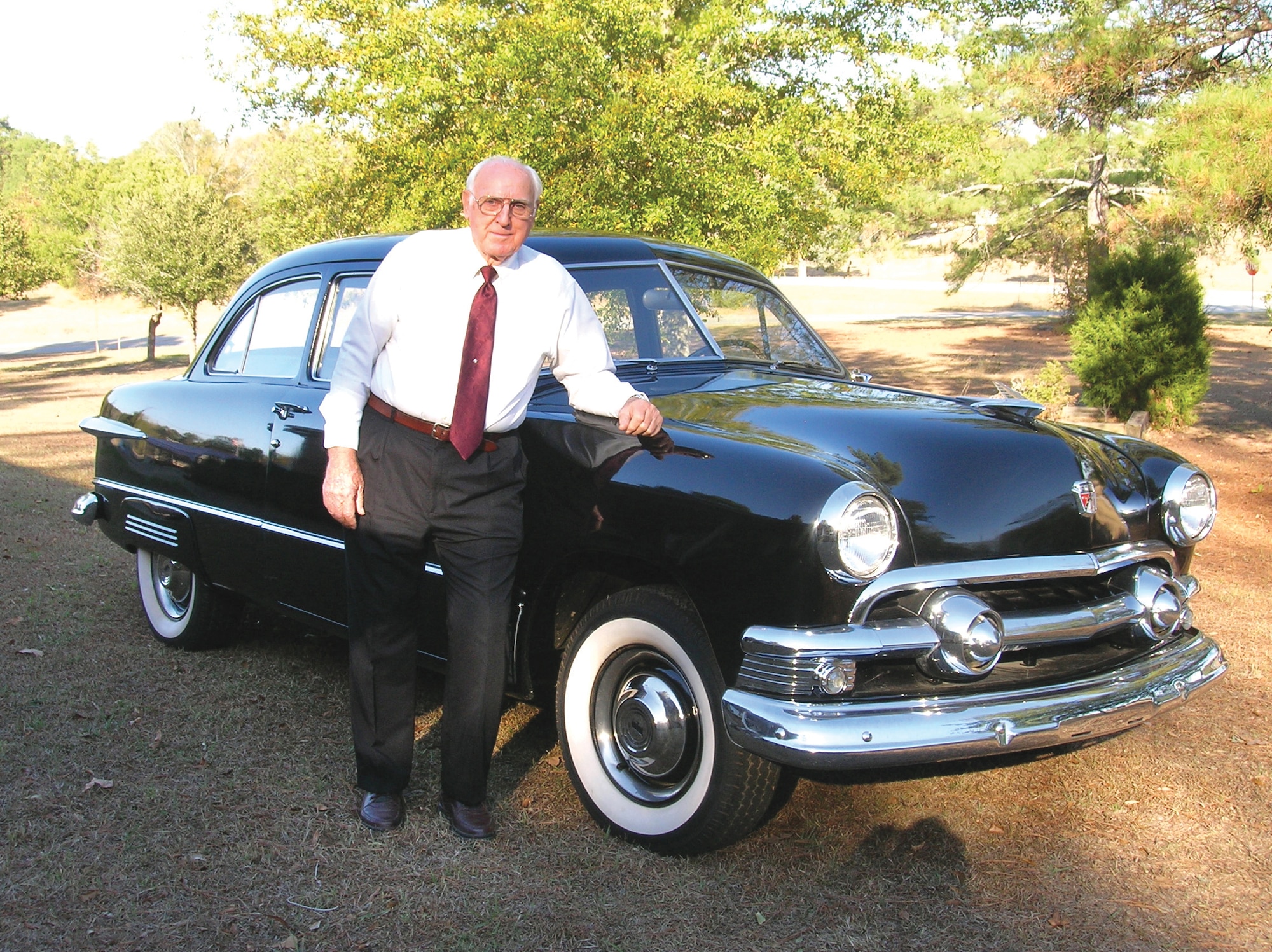 Howard Dixon stands in front of his recently restored 1951 Ford Custom Deluxe Tudor Coupe that he drove when he enlisted in the Air Force in 1952. Dixon served his country in the military and civil service for 55 years. Courtesy photo by Barbara Slay       