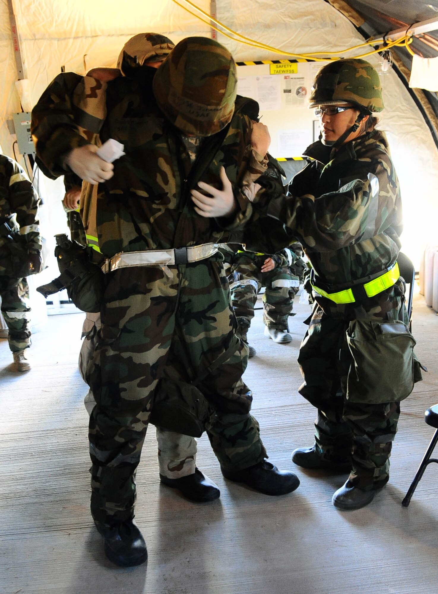 DYESS AIR FORCE BASE, TEXAS -- Airman 1st Class Yuki Saclolo, 7th Force Support Squadron, assists with restraining a suicidal Airman during a Phase II Operational Readiness Exercise here Oct. 27. In this simulated exercise Airman are evaluated on their response skills by the Exercise Evaluation Team. (U.S. Air Force photo by Senior Airman Domonique Washington)