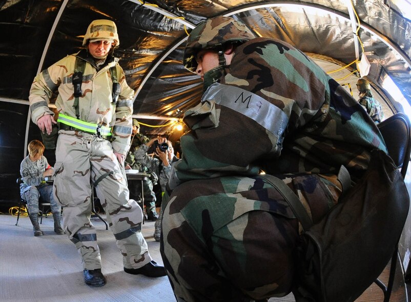 DYESS AIR FORCE BASE, Texas -- Tech. Sgt. Jacob Laird, 7th Force Support Squadron, monitors a suicidal Airman during a simulated exercise scenario here Oct. 27. Sergeant Laird’s response to the scenario is evaluated by members of the Exercise Evaluation Team. (U.S. Air Force photo by Senior Airman Domonique Washington)