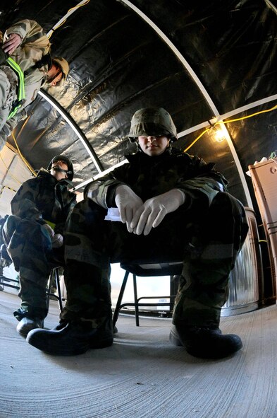 DYESS AIR FORCE BASE, Texas -- Airman 1st Class Johnathan Bosse, 7th Force Support Squadron, pretends to be suicidal during a Phase II Operational Readiness Exercise at the cantonment area here Oct. 27.  Airman Bosse is given instruction by an onsite exercise evaluator on how to behave in this simulated scenario.  (U.S. Air Force photo by Senior Airman Domonique Washington)
