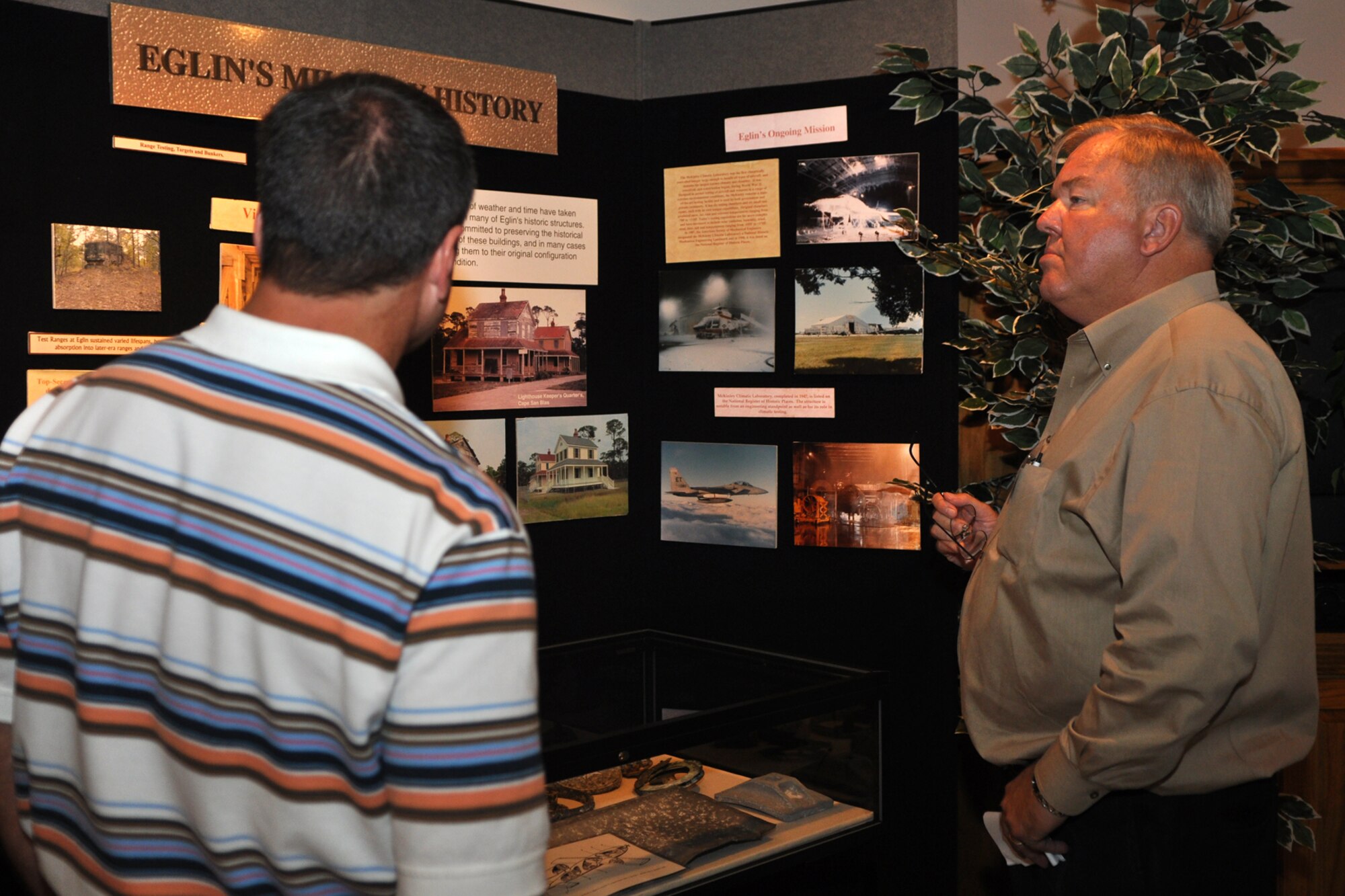 Mr. Jayson Grinage of Superior Lighting (left) and Mr. Randy Doss, A-1 Charter Service, Inc., take in the exhibits in the Artifact Curation Facility at Eglin Air Force Base, Fla., October 22, 2009. More than twenty-six influential civic leaders from the Shreveport/Bossier City area of Louisiana gained first-hand knowledge of operations of the Air Force during a two-day “Civic Leader Tour” flight from Barksdale Air Force Base, La., to Eglin AFB, on October 21-22, 2009. The leaders received several mission briefings and viewed a static display of the MC-130 Combat Talon I as well as touring several facilities at Eglin AFB and Duke Field, Fla. (U.S. Air Force photo/Tech. Sgt. Jeff Walston)