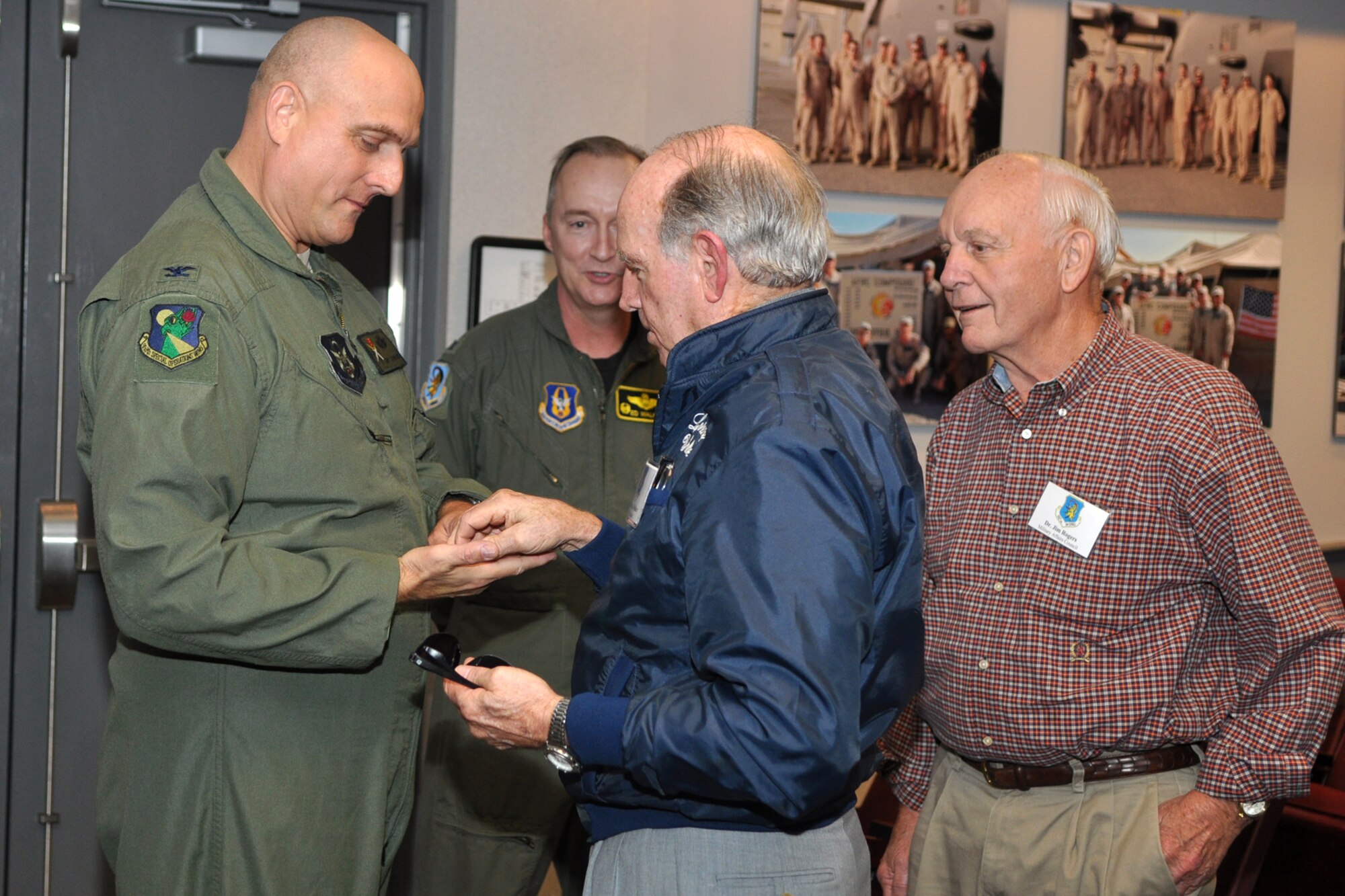 Bossier City Mayor Lorenz Walker presents a special coin to Colonel Andy Comtois, vice commander, 919th Special Operations Wing during a visit to Duke Field, Fla., October 21, 2009. Colonel Comtois conducted an entertaining briefing for a group of civic leaders about the mission capabilities of the 919th SOW during their two-day visit to Eglin Air Force Base, Fla. More than twenty-six influential civic leaders from the Shreveport/Bossier City area of Louisiana gained first-hand knowledge of operations of the Air Force during a two-day “Civic Leader Tour” flight from Barksdale Air Force Base, La., to Eglin AFB, on October 21-22, 2009. The leaders received several mission briefings and viewed a static display of the MC-130 Combat Talon I as well as touring several facilities at Eglin AFB and Duke Field, Fla. (U.S. Air Force photo/Tech. Sgt. Jeff Walston)
