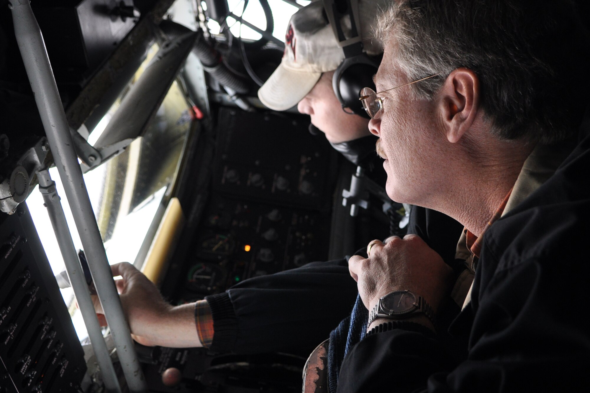 Staff Sgt. Jason Wesche, boom operator, 931st Aircraft Maintenance Squadron, McConnell, Air Force Base, Kan., does his job as Mr. Christopher Kinsey, Norman Corporation of Caddo, Inc., shoots a picture of an A-10 Thunderbolt II conducting an in air refueling from the KC-135 Stratotanker, October 21, 2009. More than twenty-six influential civic leaders from the Shreveport/Bossier City area of Louisiana gained first-hand knowledge of operations of the Air Force during a two-day “Civic Leader Tour” flight from Barksdale Air Force Base, La., to Eglin Air Force Base, Fla., on October 21-22, 2009. The leaders received several mission briefings and viewed a static display of the MC-130 Combat Talon I as well as touring several facilities at Eglin AFB and Duke Field, Fla. 