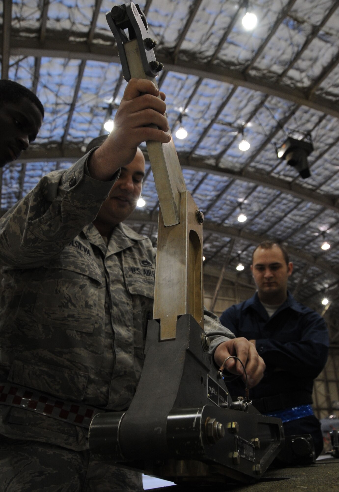EELMENDORF AIR FORCE BASE, Alaska -- Staff Sgt. Randy DaSilva explains the procedures for checking a boom assembly during missile load certification training Oct. 23. Airmen must be certified on all missile loading procedures once a month. DaSilva is a squadron lead crew team chief for the 3rd Mission Operations Squadron. (U.S. Air Force photo/Senior Airman Cynthia Spalding)