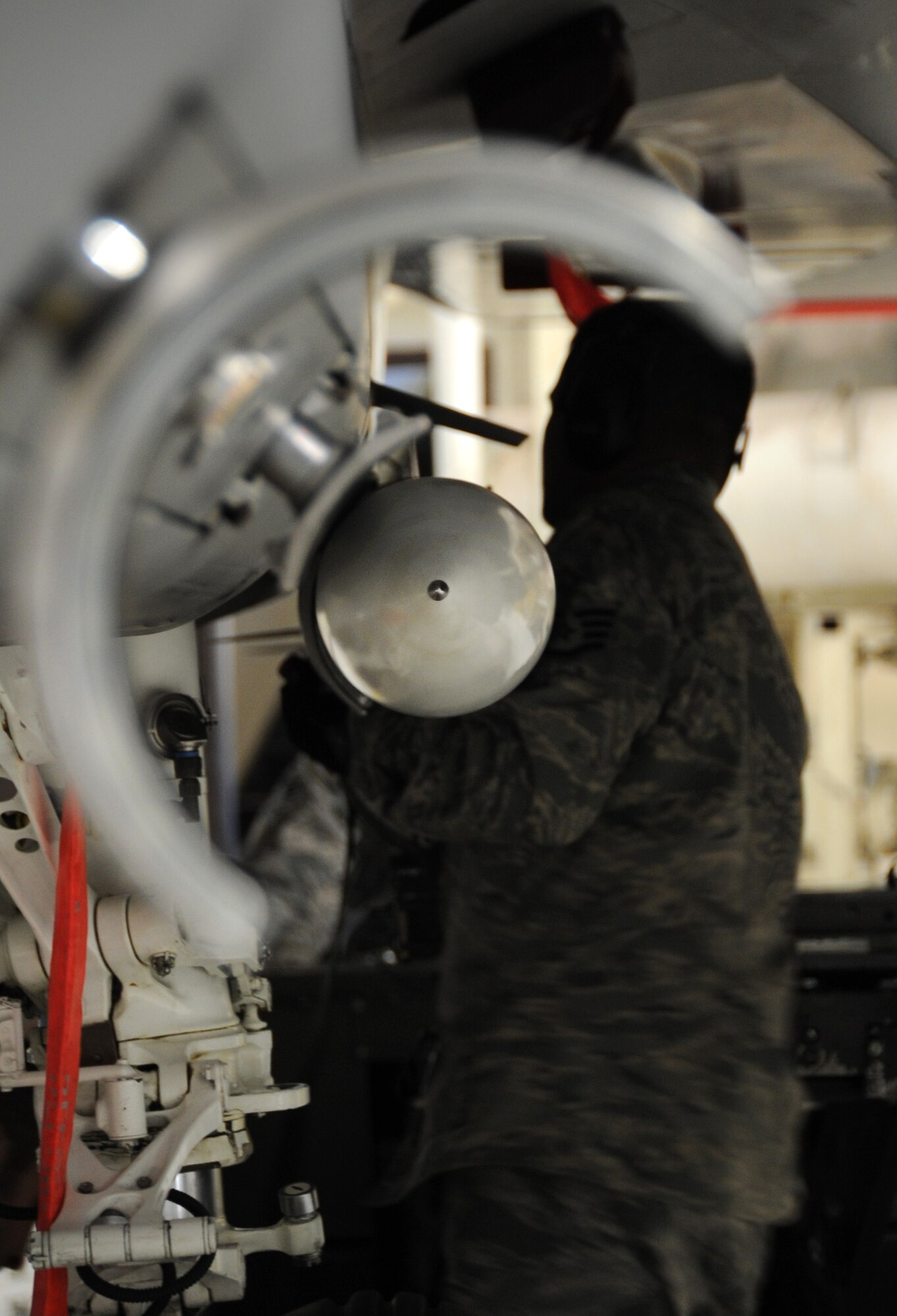 ELMENDORF AIR FORCE BASE, Alaska -- Staff Sgt. Leon Schilling sways an air intercept missile 120 on an F-15 Oct. 20. Swaying a missile during a load is a procedure to make sure the missile is securely loaded to the aircraft. Schilling is an aircraft armament systems specialist with the 19th Aircraft Maintenance Unit. (U.S. Air Force photo/Senior Airman Cynthia Spalding)