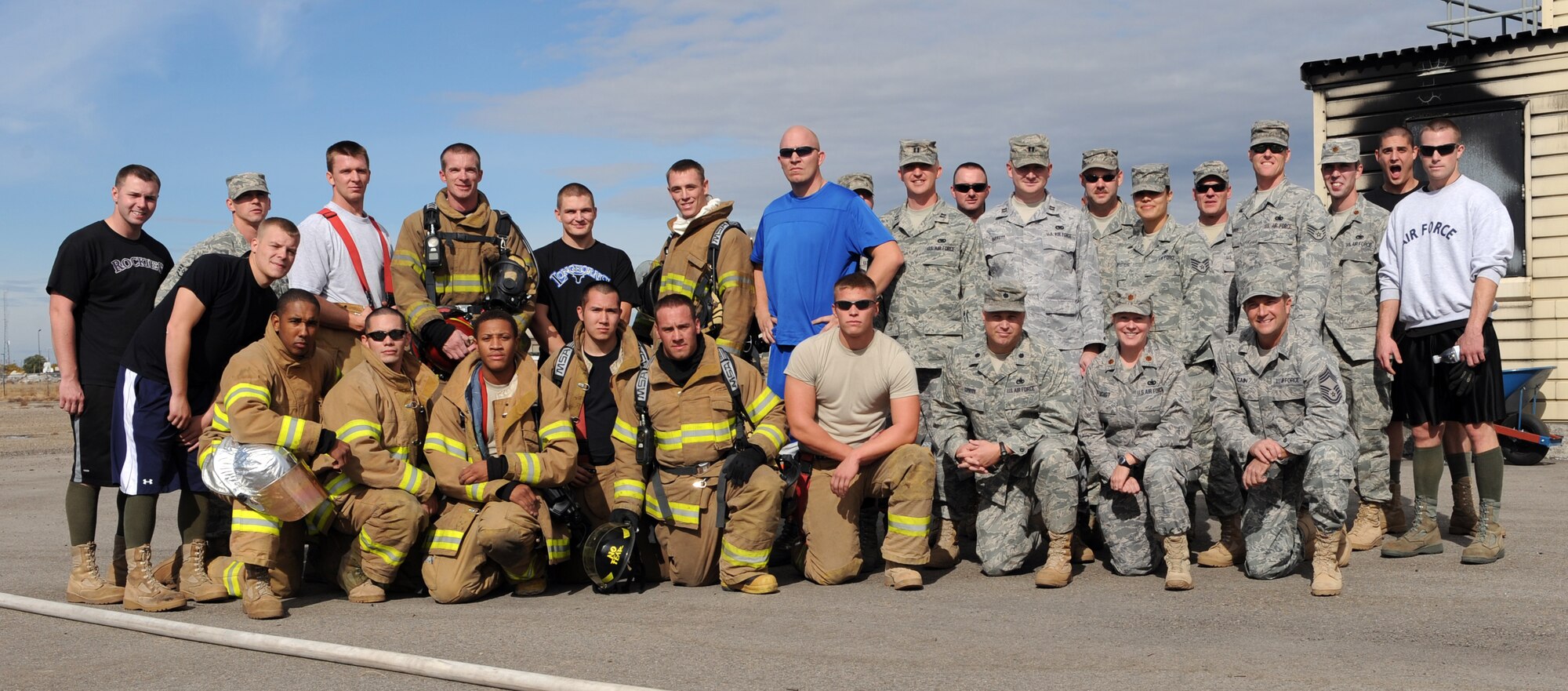 MOUNTAIN HOME AIR FORCE BASE, Idaho --  Members of the 366th Logistics Readiness Squadron team and the 366th Civil Engineering Squadron fire department pose for a group picture after the first annual Fire Muster Challenge Oct. 23. Six teams competed in the timed challenge that consisted of five events. 366th LRS team came in first place with a time of 2:53, 366th CES explosive ordnance disposal came in second with a time of 3:18 and in third place was the senior noncommissioned officers with a time of 3:31. The fire department ultimately won the championship round with a time of 2:38. (U.S. Air Force photo by Airman 1st Class Debbie Lockhart)