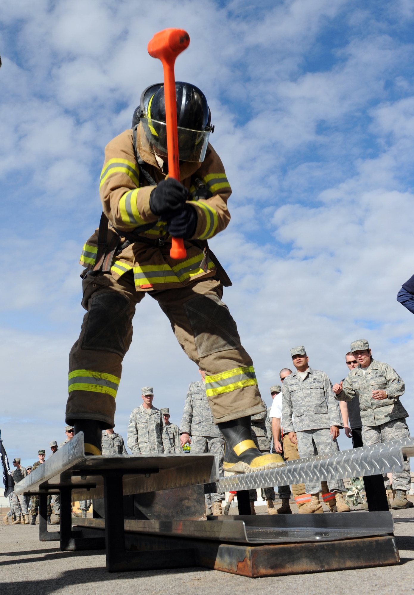 MOUNTAIN HOME AIR FORCE BASE, Idaho -- Staff Sgt. Troy Zimmerman, 366th Civil Engineer Squadron emergency management team member, uses a sledge hammer to hit a weight across a keiser sled as part of the first annual Fire Muster Challenge Oct. 23. Six teams competed in the timed challenge that consisted of five events. 366th Logistics Readiness Squadron team came in first place with a time of 2:53, 366th CES explosive ordnance disposal came in second with a time of 3:18 and in third place was the senior noncommissioned officers with a time of 3:31. The fire department ultimately won the championship round with a time of 2:38. (U.S. Air Force photo by Airman 1st Class Debbie Lockhart)