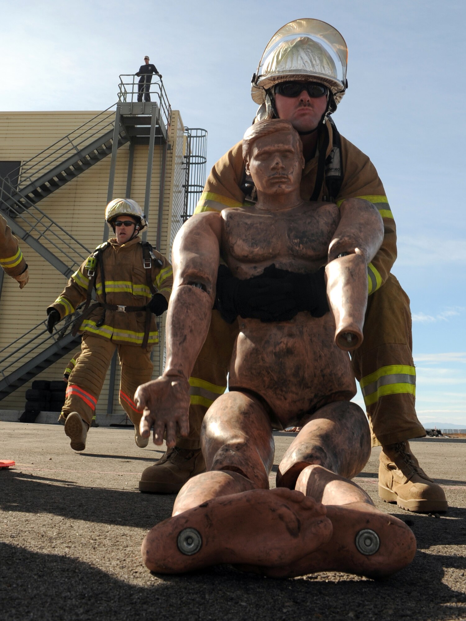 MOUNTAIN HOME AIR FORCE BASE, Idaho -- Tech. Sgt. Jeremiah Fentress, 366th Logistics Readiness Squadron Petroleum, Oils and Lubricants team member, carries a 165 pound dummy as part of the first annual Fire Muster Challenge Oct. 23. Six teams competed in the timed challenge that consisted of five events. 366th LRS came in first place with a time of 2:53, 366th Civil Engineer Squadron explosive ordnance disposal came in second with a time of 3:18 and in third place was the senior noncommissioned officers with a time of 3:31. The fire department ultimately won the championship round with a time of 2:38. (U.S. Air Force photo by Airman 1st Class Debbie Lockhart)