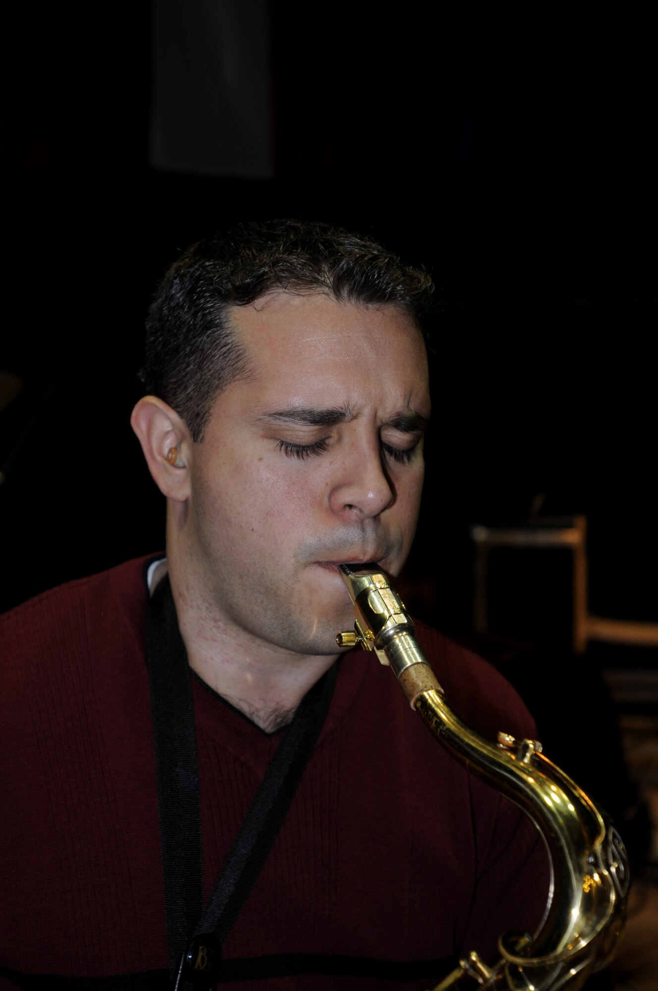 BYDGOSZCZ, Poland – Senior Airman Lencys Esteban-Nunez warms up on his saxophone prior to sound check at the Cultural Center of the Pomeranian Military Ward here Oct. 25.  The U.S. Air Forces in Europe Band is performing six concerts in six days, Oct. 20-25, in support of USAFE's international relations program in partnership with the U.S. State Department.  More than 2,500 people attended this concert series which commemorates 90 years of diplomatic relations between the United States and Poland.  (U.S. Air Force photo/Master Sgt. Kelley J. Stewart)