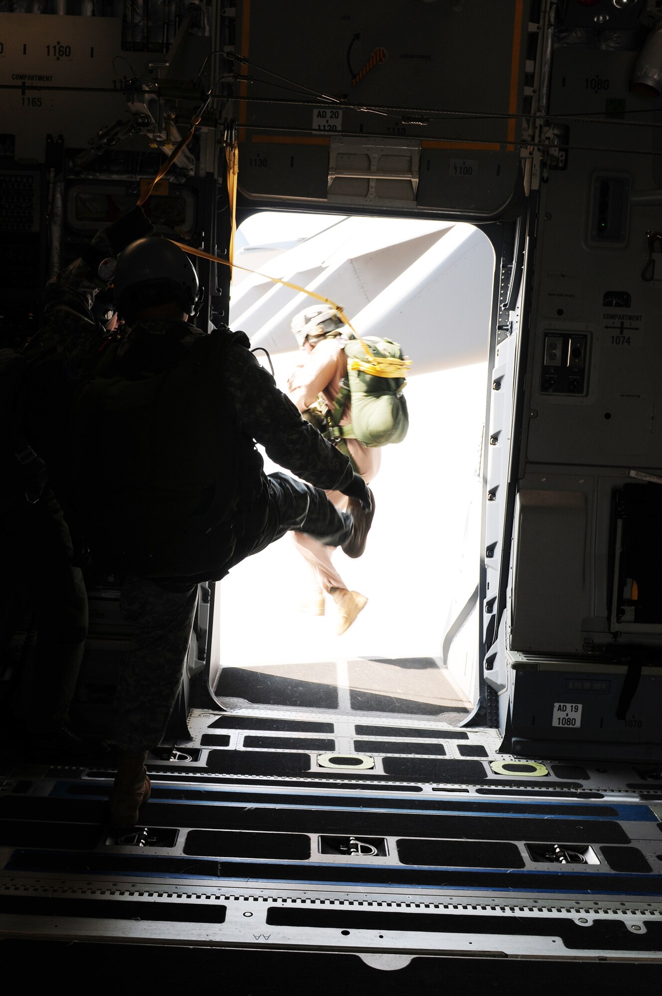 Tech. Sgt. John Gaona executes a static jump out of a C-17 Globemaster III Oct. 23, 2009. Sergeant Gaona was a jumpmaster during Cope India. Cope India is a United States and India airlift exercise that provides training for humanitarian assistance and disaster relief operations. (U.S. Air Force photo/Capt. Genieve David) 