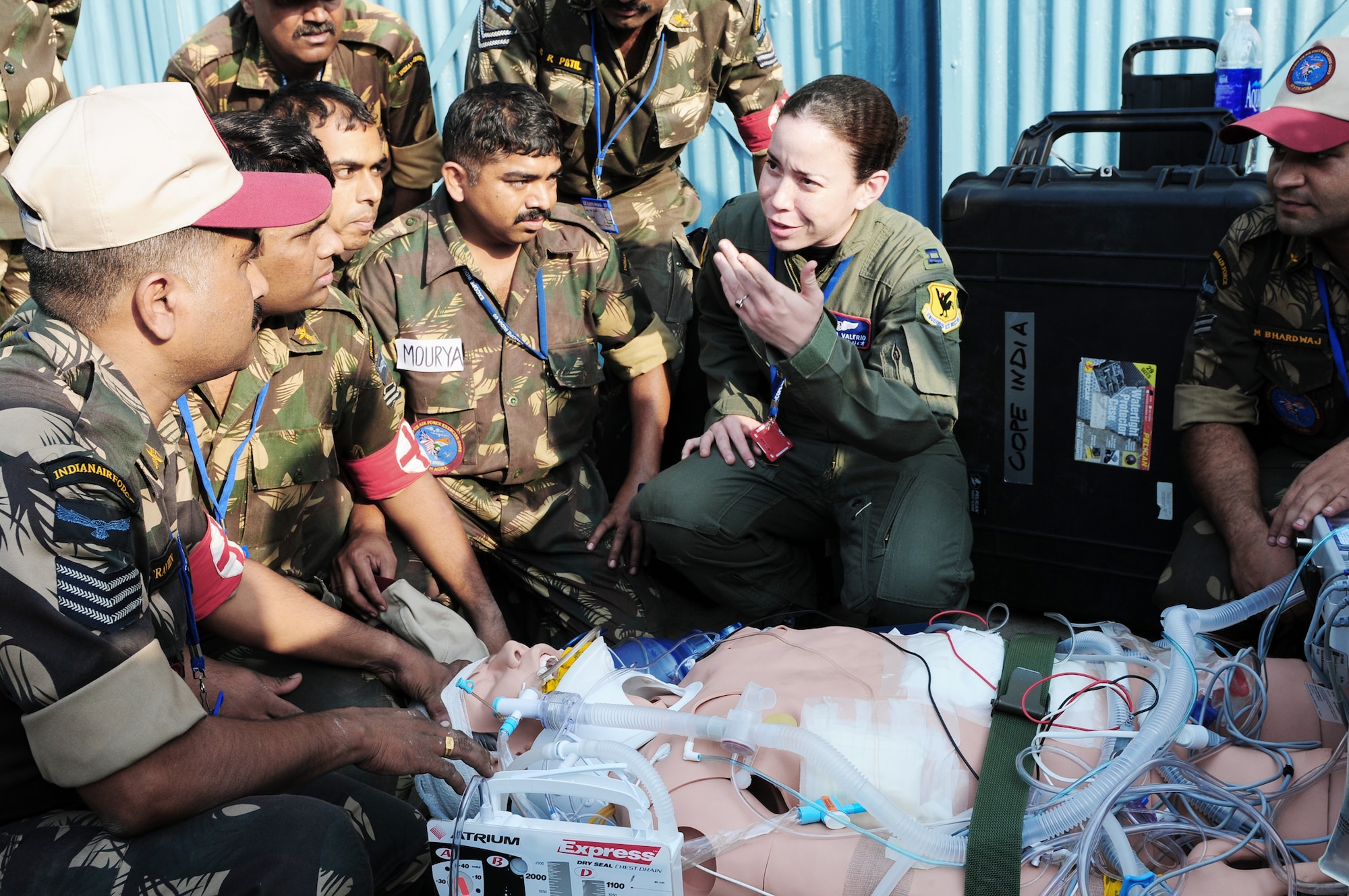 Capt. Veronica Valerio explains emergency response techniques to several Indian air force medics during Cope India at Air Force Station Agra, India, Oct. 22, 2009. Captain Valerio is from the 18th Wing at Kadena Air Base, Japan. Cope India is a United States and India airlift exercise that provides training for humanitarian assistance and disaster relief operations. (U.S. Air Force photo/Capt. Genieve David)