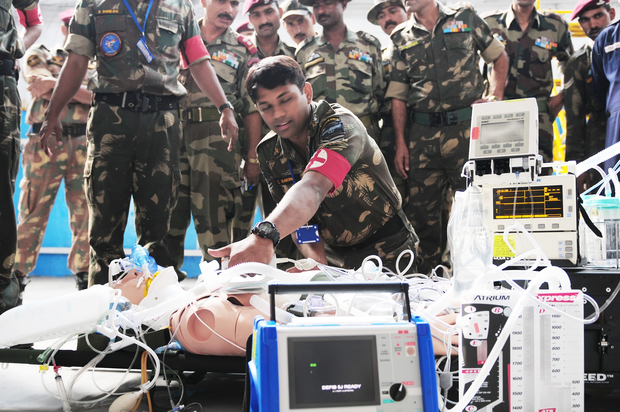 An Indian air force medic provides emergency response on a mannequin patient during a U.S. Air Force medical demonstration as part of exercise Cope India Oct. 21, 2009. Cope India is humanitarian assistance disaster relief exercise scheduled Oct. 19 to 23. (U.S. Air Force photo/Capt. Genieve David)