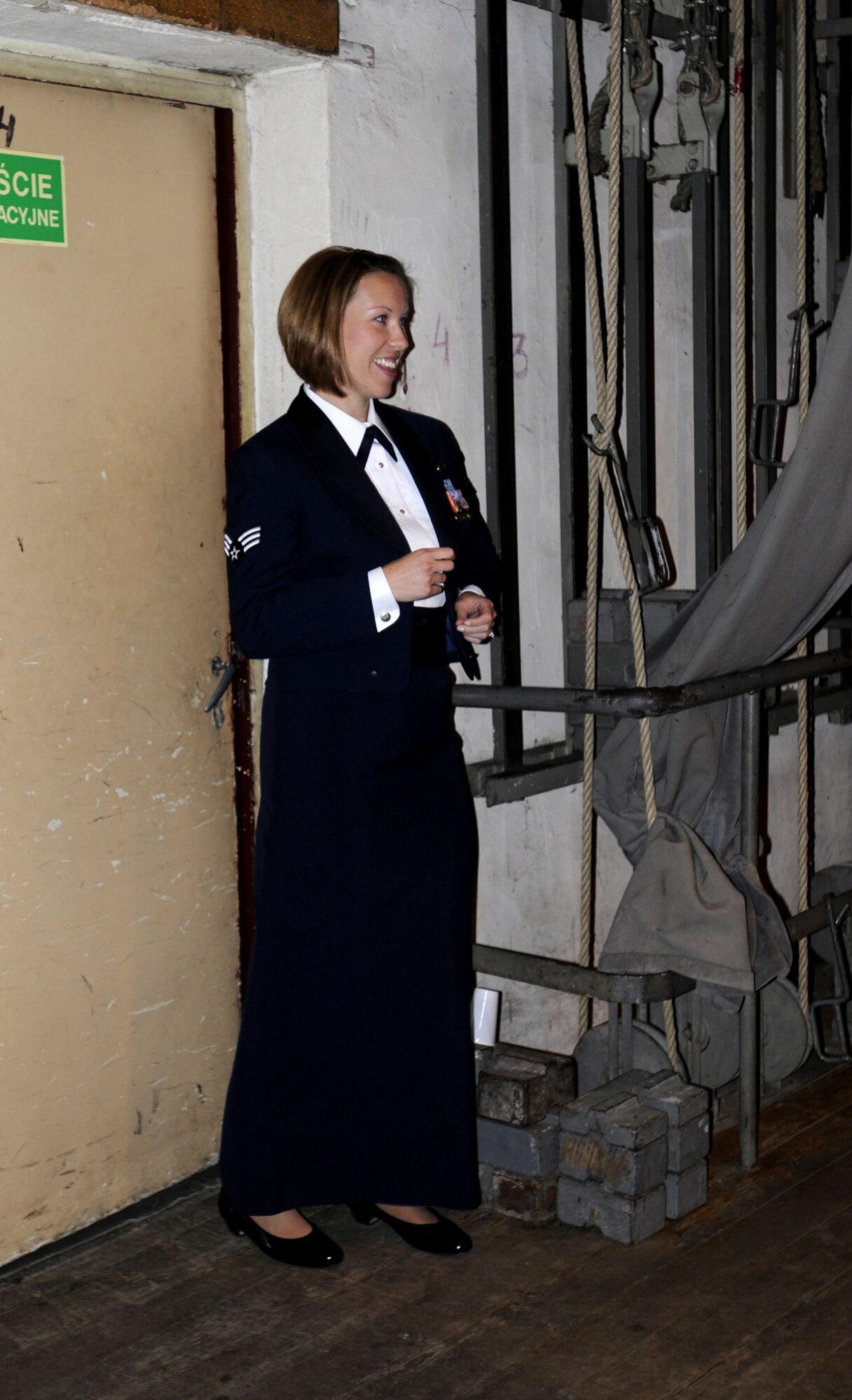 KUTNO, Poland – Senior Airman Rachel Trimble, vocalist, dances backstage while Check Six performs Oct. 24 at the Kutno Cultural Center.  Check Six is one of five smaller groups made up of musicians from the U.S. Air Forces in Europe Concert Band.  The band is performing six concerts in six days, Oct. 20-25, in support of USAFE's international relations program in partnership with the U.S. State Department.  Four hundred people from Kutno attended this concert which commemorates 90 years of diplomatic relations between the United States and Poland.  (U.S. Air Force photo/Master Sgt. Kelley J. Stewart)