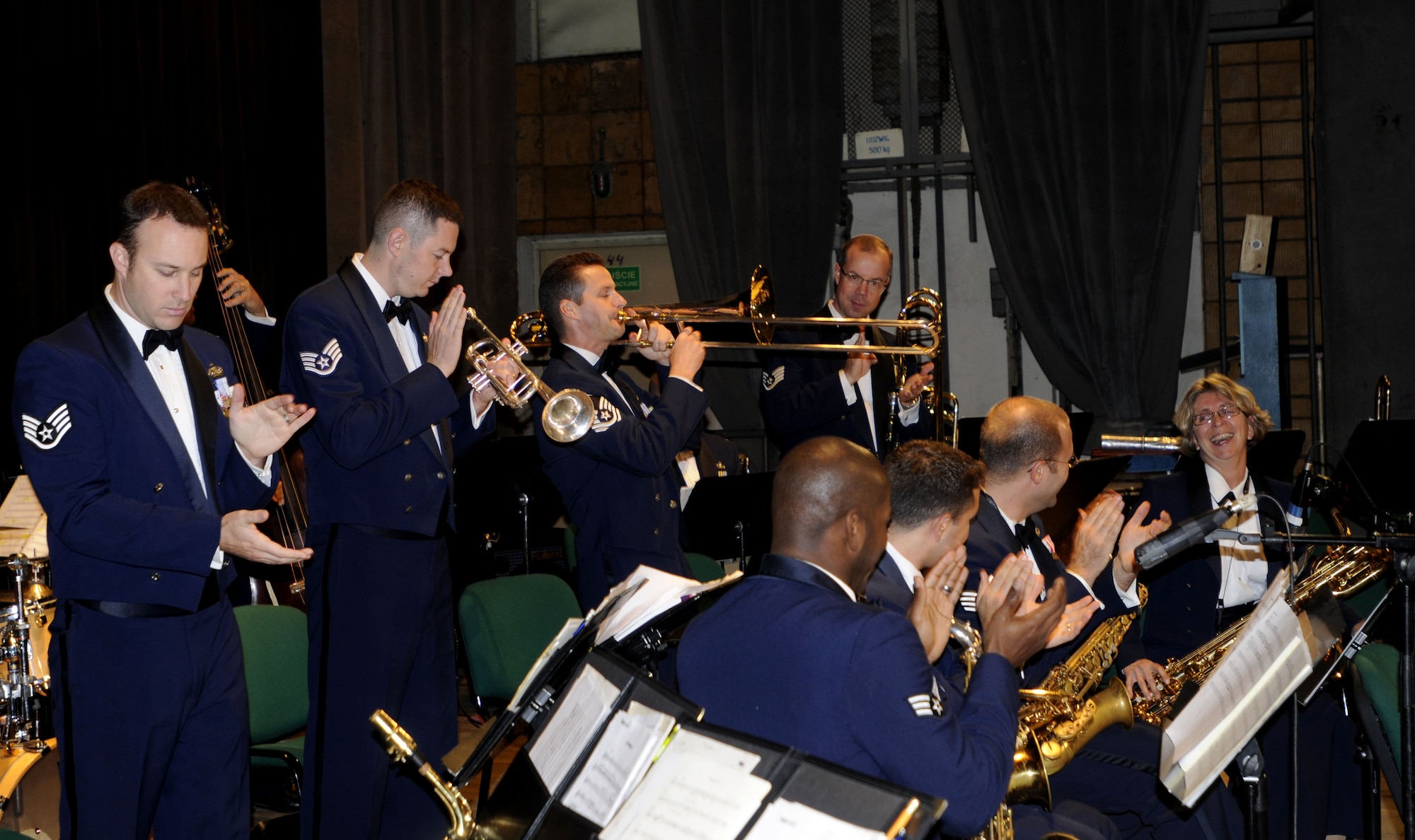 KUTNO, Poland – Members of Check Six get the crowd clapping during a trombone solo by Master Sgt. Charles Anderson Oct. 24 at the Kutno Cultural Center.  Check Six is one of five smaller groups made up of musicians from the U.S. Air Forces in Europe Concert Band.  The band is performing six concerts in six days, Oct. 20-25, in support of USAFE's international relations program in partnership with the U.S. State Department.  Four hundred people from Kutno attended this concert which commemorates 90 years of diplomatic relations between the United States and Poland.  (U.S. Air Force photo/Master Sgt. Kelley J. Stewart)