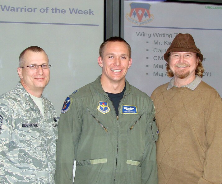 The 71st Flying Training Wing Warriors of the Week are members of the Wing writing team. Team members in photo from left: Chief Master Sgt. Andrew Ridenhower, Capt. Joseph Markowski and Eugene Kampe. Not in picture are: Maj. Danielle Willis and Maj William Annexstad. (U.S. Air Force photo/ Joe B. Wiles)