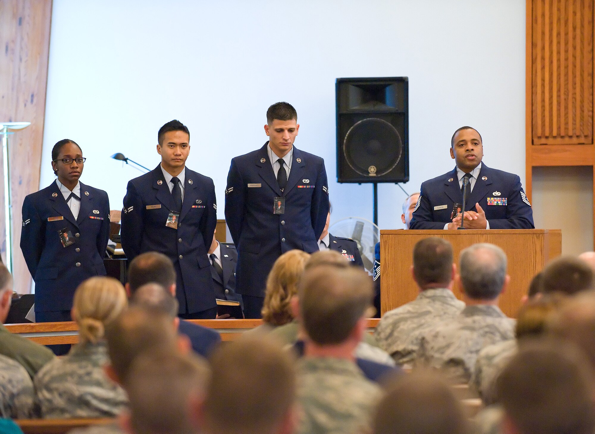 Tech. Sgt. Cedric Clinton, 436th Aircraft Maintenance Squadron, speaks during a memorial service for Airman Sean M. McDowell, 24, of Covina, Calif., Oct. 22. Sergeant Clinton shared a conversation he had with Airman McDowell about overcoming obstacles and past mistakes.  Airmen 1st Class Alexandria Jones, Daryl Nejar and Fermin Rodriguez also shared memories of their friend. (U.S. Air Force photo/Jason Minto)