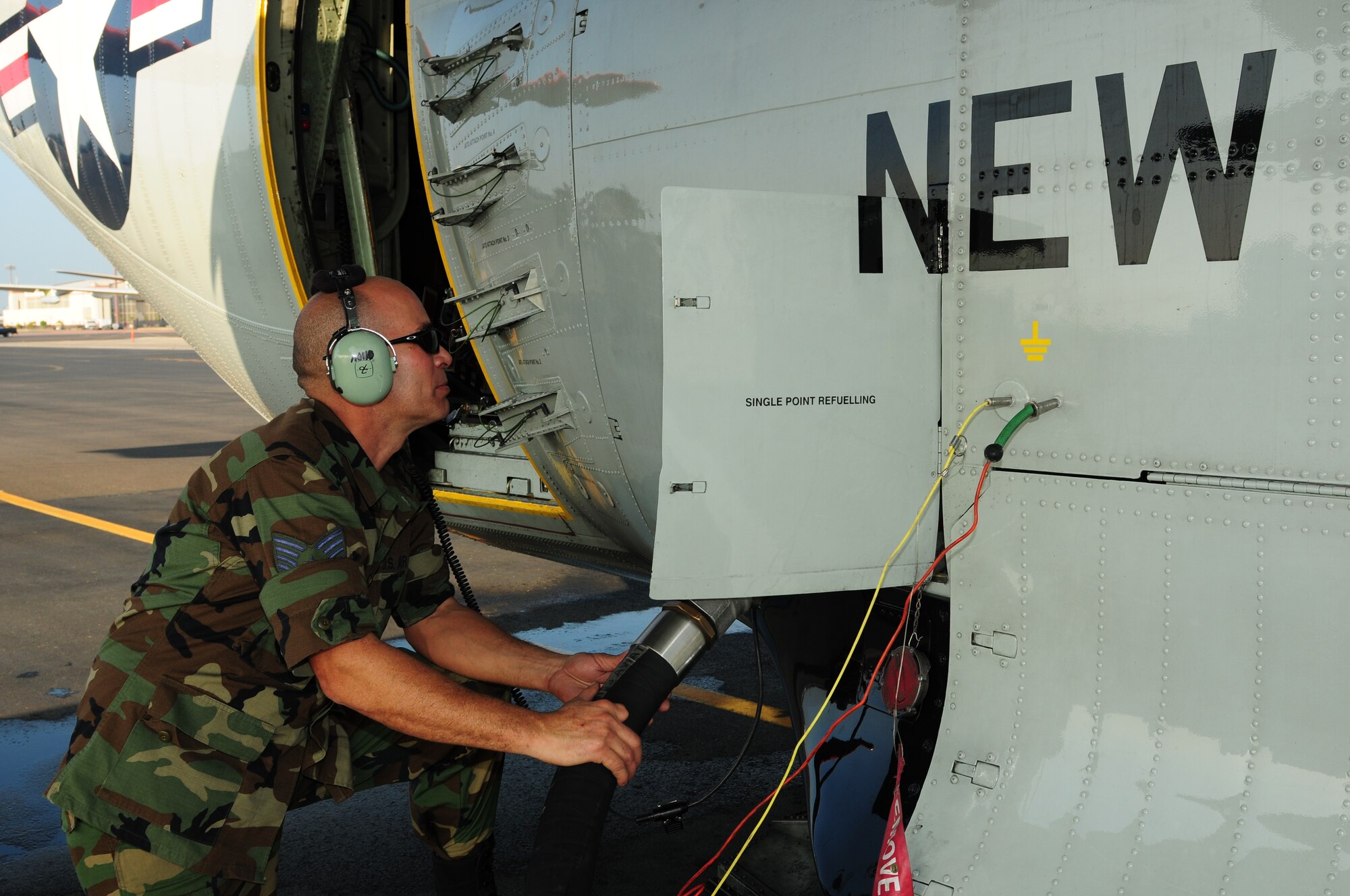 Tech. Sgt. David Aymat refuels an LC-130 Hercules at Hickam Air Force Base, Hawaii, on Oct. 28 in preparation for a flight to Antarctica. Sergeant Aymat and the rest of his LC-130 aircrew stopped at Hickam while en route to Antarctica to support Operation Deep Freeze, the Department of Defense's logistical support to U.S. research activities at the southernmost continent. Sergeant Aymat is an LC-130 crew chief assigned to the New York Air National Guard’s 109th Airlift Wing at Stratton Air National Guard Base, N.Y. (U.S. Air Force photo/Tech. Sgt. Kerry Jackson)