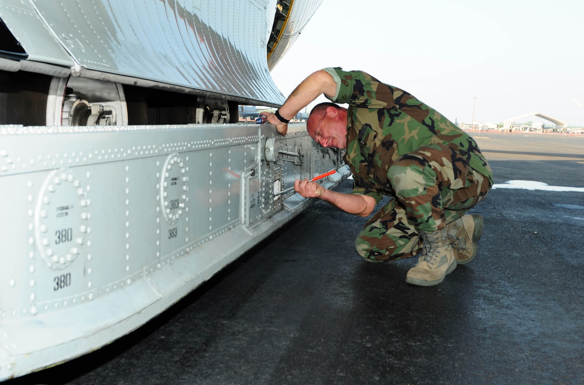 Master Sgt. Joseph Sinatra checks the air spring pressure on an LC-130 Hercules during a stop at Hickam Air Force Base, Hawaii, on Oct. 28. The springs are used to absorb the shock of landing the ski-equipped aircraft on the Antarctic ice. Sergeant Sinatra and the rest of his LC-130 aircrew stopped at Hickam while en route to Antarctica to support Operation Deep Freeze, the Department of Defense's logistical support to U.S. research activities at the southernmost continent. Sergeant Sinatra is an LC-130 crew chief assigned to the New York Air National Guard’s 109th Airlift Wing at Stratton Air National Guard Base, N.Y. (U.S. Air Force photo/Tech. Sgt. Kerry Jackson)