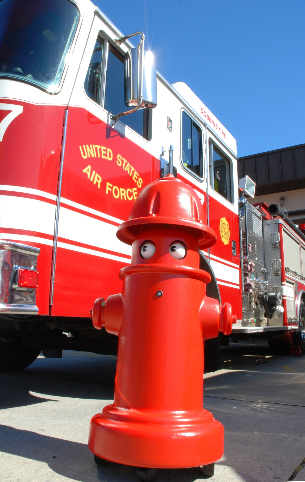 Meet the newest member of the Dobbins ARB Fire Emergency Services team--"Pluggie The Fire Plug," a robotic fire hydrant.  Pluggie is radio controlled.  He has a two-way voice communication system, and squirts water. 

Pluggie also moves around and has life-like eye movement. "Pluggie will be a great asset to our fire prevention education program," said Assistant Fire Chief Bill Wilson.  "He will get plenty of exposure with the increase in fire station tours by various age groups." (U.S. Air Force photo/Master Sgt. Stan Coleman)