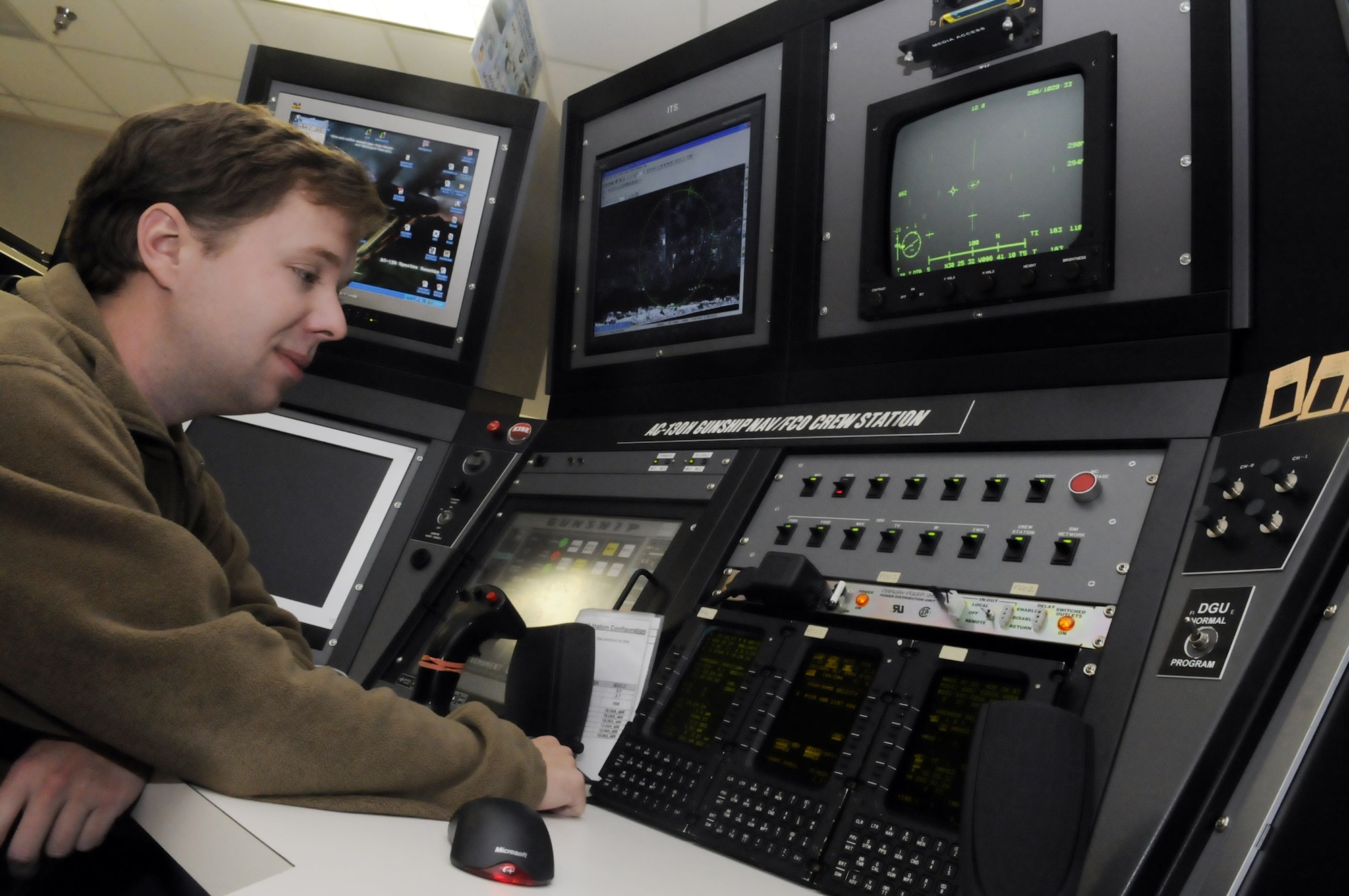 Tim Doughty, test engineer, works at the C-130 Gunship console which shows how avionics and firing software might work when used on an aircraft. U. S. Air Force photo by Sue Sapp