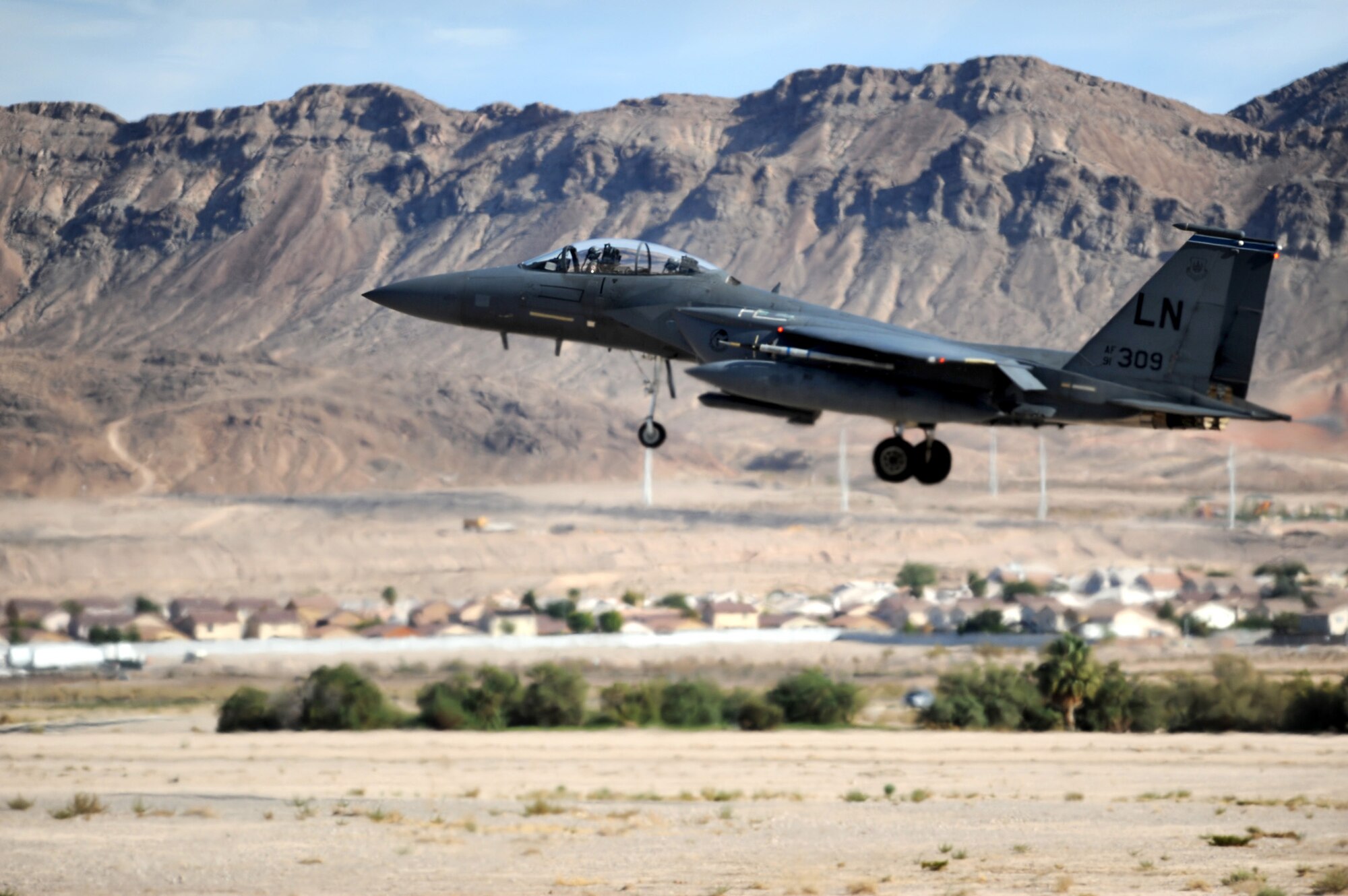 NELLIS AIR FORCE BASE, Nev. --  A U.S. Air Force F-15E from RAF Lakenheath, England prepares to land at the Nellis flight line Red Flag 10-1, Oct. 22, 2009. Red Flag is a realistic combat training exercise involving the air forces of the United States and its allies. The exercise is conducted on the 15,000-square-mile Nevada Test and Training Range, north of Las Vegas. (U.S. Air Force photo by Airman 1st Class Brett Clashman)(Released)