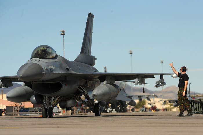 NELLIS AIR FORCE BASE, Nev. -- 1st Sgt. Jorck Bouter a crew chief from the Royal Netherlands Air Force gives a thumbs up to Royal Netherlands Pilot, Capt. Herman Jan before a training mission at Red Flag 10-1.  Red Flag is a realistic combat training exercise involving the air forces of the United States and its allies. The exercise is conducted on the 15,000-square-mile Nevada Test and Training Range, north of Las Vegas. (U.S. Air Force photo by Tech. Sgt. Michael R. Holzworth)(Released)