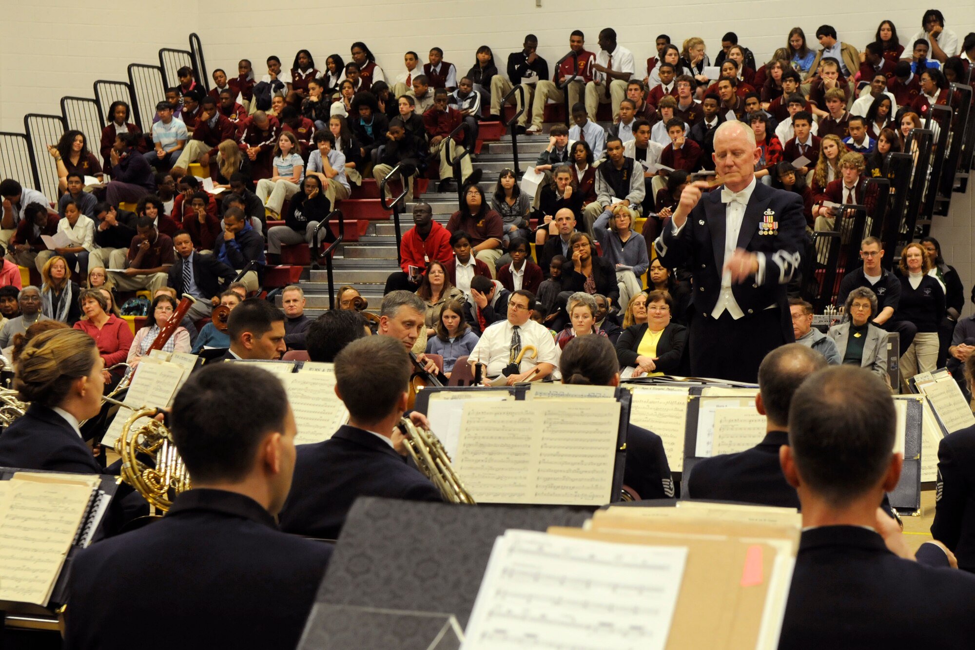 Lt. Col. Alan Sierichs, United States Air Force Band commander, directs the Band during a performance at Bishop McNamara High School Oct. 27 in Forestville, Md. The Band performed several musical pieces during the two-hour concert for more than 200 students and parents. The largest musical ensemble of The United States Air Force Band is the Concert Band. Performing regularly for the general public in the greater Washington, D.C., area and on biannual community relations tours throughout the United States, The Air Force Concert Band is also in constant demand by many of the world's most highly respected professional musical organizations. The Concert Band is proud to represent the United States as a component of The United States Air Force Band, "America's International Musical Ambassadors."
 (U.S. Air Force photo by Staff Sgt. Tim Chacon)
