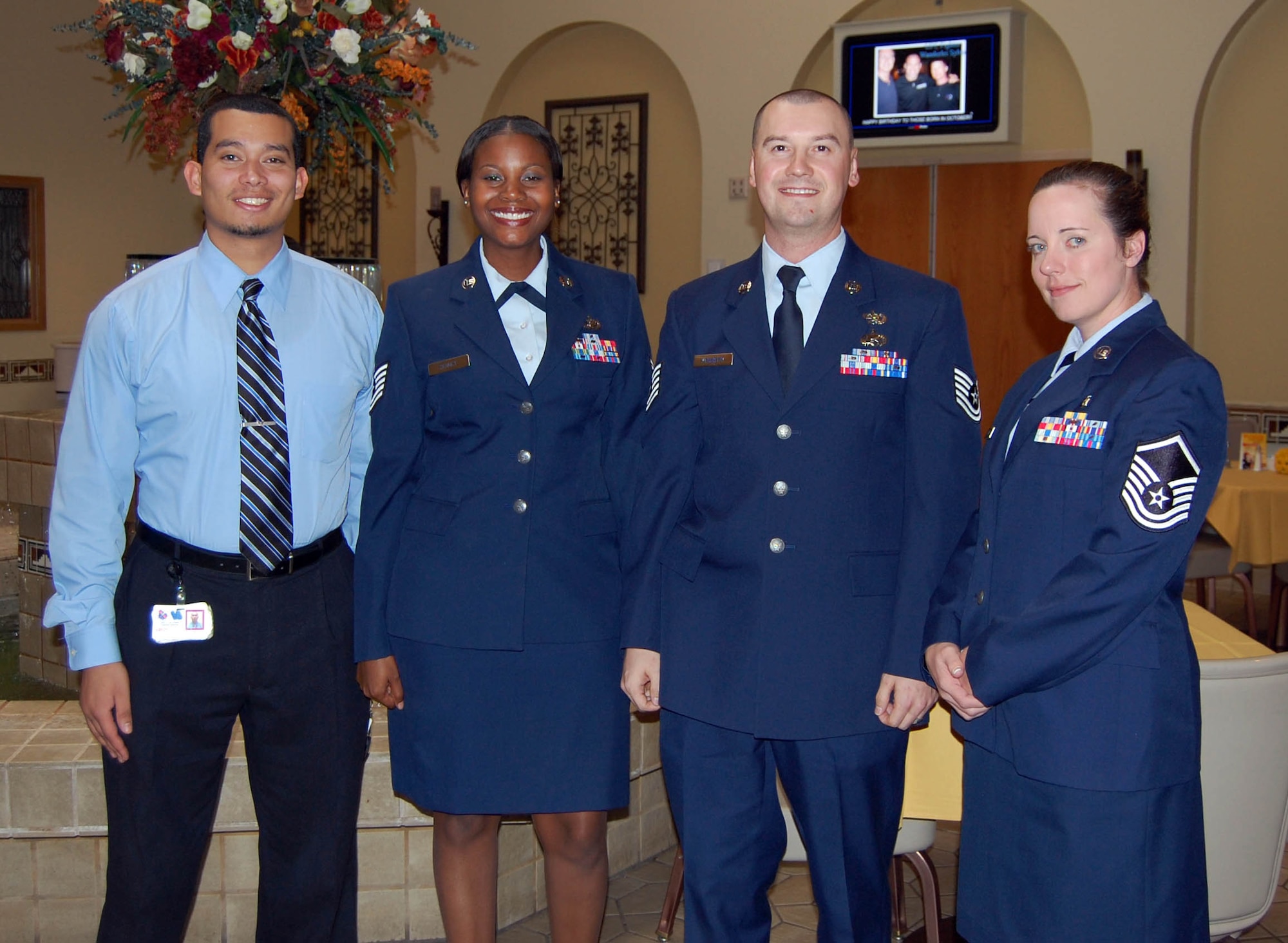 (Left to right) Senior Airman Alexander Turner, Tech. Sgt. Vickie Sennet, Tech. Sgt. Lee McKinstry and Master Sgt. Dawn Kaighen celebrate their graduation from the Community College of the Air Force here Oct. 27. The CCAF is the largest regionally accredited multi-campus junior or technical college in the world. Graduates are awarded an Associate in Applied Science Degree for successful completion of a degree program relating to the their Air Force career specialty. (U.S. Air Force Reserve photo/Capt. Jessica Martin)