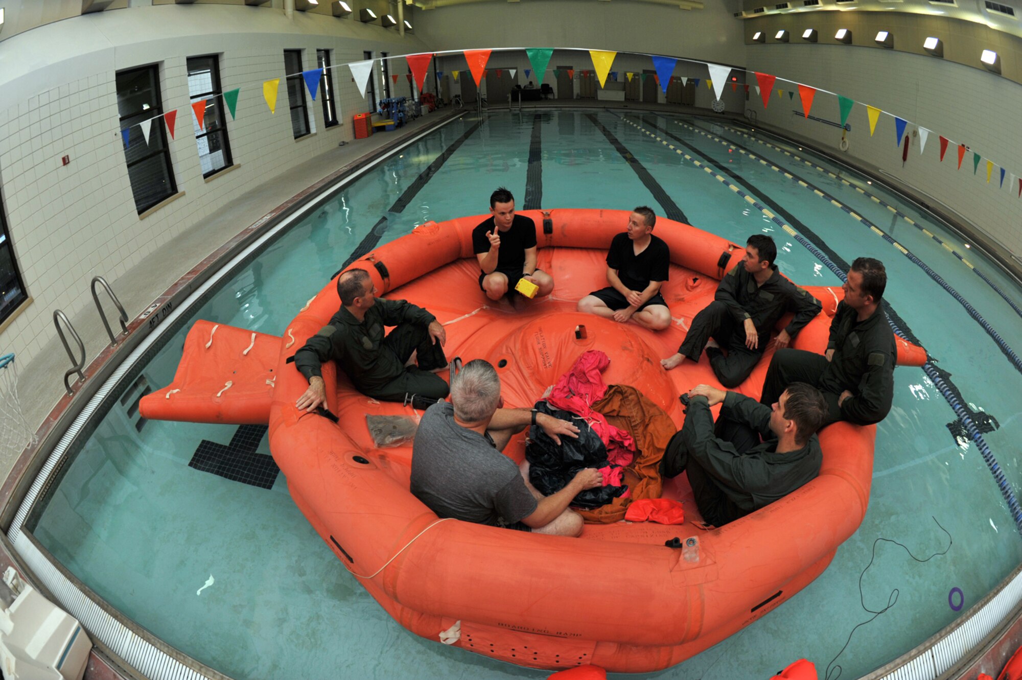 Airmen assigned to the 931st Air Refueling Group listen to instruction during a water survival class at McConnell Air Force Base, Kan., on Oct. 19. The class was part of a two-day "Training Frenzy" designed to eliminate time 931st Reservists spend on ancillary readiness requirements during monthly duty weekends. (U.S. Air Force photo/Master Sgt. Jason Schaap)  