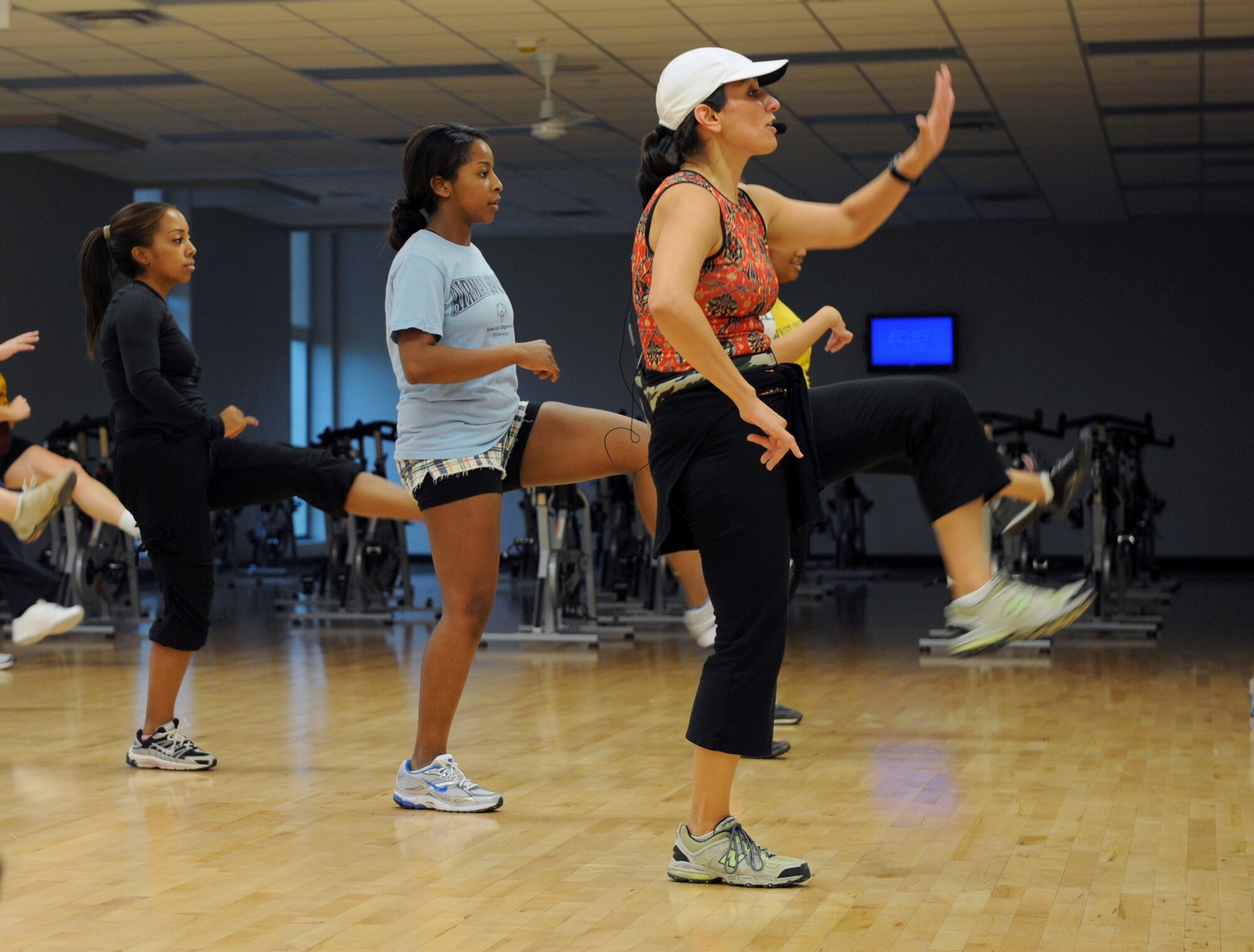 MINOT AIR FORCE BASE, N.D. -- Alison Ely, personal fitness instructor, conducts floor aerobics at the McAdoo Sports and Fitness Center here, Oct. 27. For people looking to improve their physical fitness, the fitness center has Zumba classes Tuesdays at 5 p.m. and Thursday at 6 p.m. The Zumba classes program fuses hypnotic Latin rhythms and easy-to-follow moves to help people stay in shape. (U.S. Air Force photo by Airman 1st Class Jesse Lopez)
