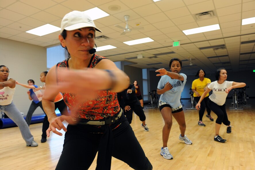 MINOT AIR FORCE BASE, N.D. -- Alison Ely, personal fitness instructor, conducts floor aerobics at the McAdoo Sports and Fitness Center here, Oct. 27. For people looking to improve their physical fitness, the fitness center has Zumba classes Tuesdays at 5 p.m. and Thursday at 6 p.m. The Zumba classes program fuses hypnotic Latin rhythms and easy-to-follow moves to help people stay in shape. (U.S. Air Force photo by Airman 1st Class Jesse Lopez)