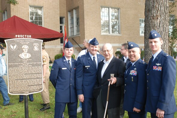 Airman Josh Mills, a 714th Training Squadron student; Col. Kirk Lear, 314th Airlift Wing vice commander; Maj. Dennis Higuera, 314th Maintenance Operations Squadron commander; and Maj. Jason Shephard, 48th Airlift Squadron chief of training; represented Little Rock Air Force Base in Camden, Ark., Oct. 17 at the unveiling of a plaque honoring a Doolittle Raider, retired Air Force Lt. Col. Robert Hite. Then-Capt. Hite was co-pilot of a B-25 Mitchell medium bomber nicknamed "Bat Out of Hell," the last of 16 aircraft launched from the deck of the aircraft carrier USS Hornet on April 18, 1945, in the United States' first direct attack on the Japanese islands. All 16 aircraft from that mission crash-landed or ditched at sea after the attack, and 11 of 80 crewmembers were lost; many others, including Colonel Hite, were captured. Colonel Hite endured torture and lost half his body weight before being repatriated after 40 months in captivity. He went on to serve in the Korean War and is one of just six living members of the original 80 Doolittle Raiders. (U.S. Army photo by Capt. Adam Hallmark)