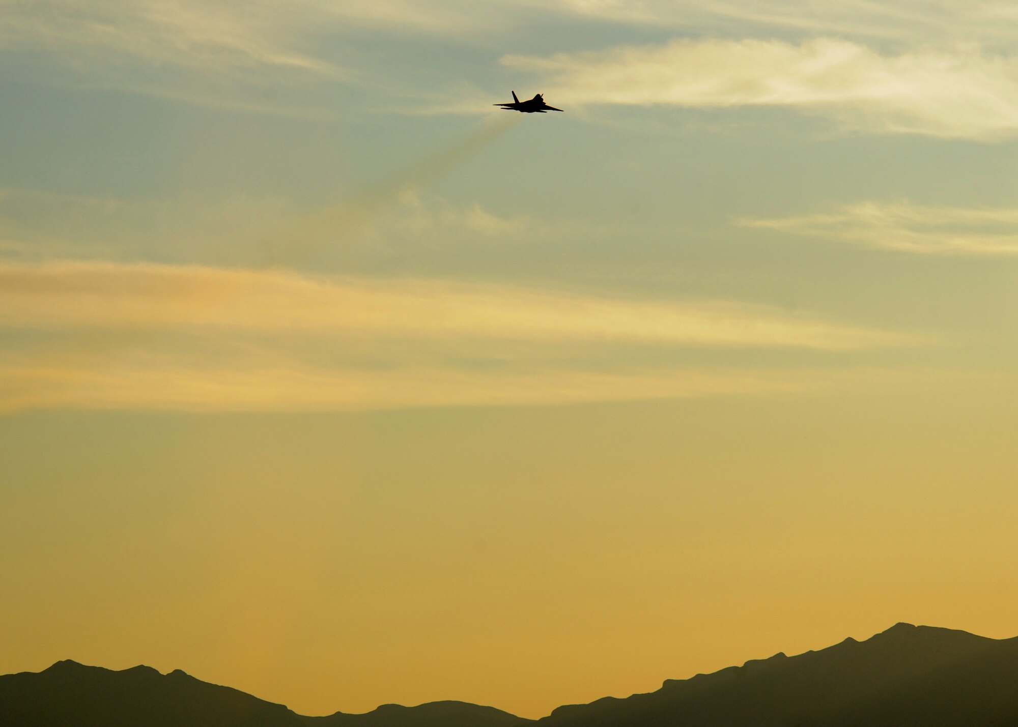 HOLLOMAN AIR FORCE BASE, N.M. -- The F-22A Raptor demonstration team out of Langley AFB, Va., performs a sunset demonstration, flying a Holloman F-22A, during the fall festival here Oct. 23. More than 400 Team Holloman members who attended the event got to witness the exclusive preview of the act to be performed the next day at the Holloman Open House. (U.S. Air Force photo by Senior Airman Michael Means)