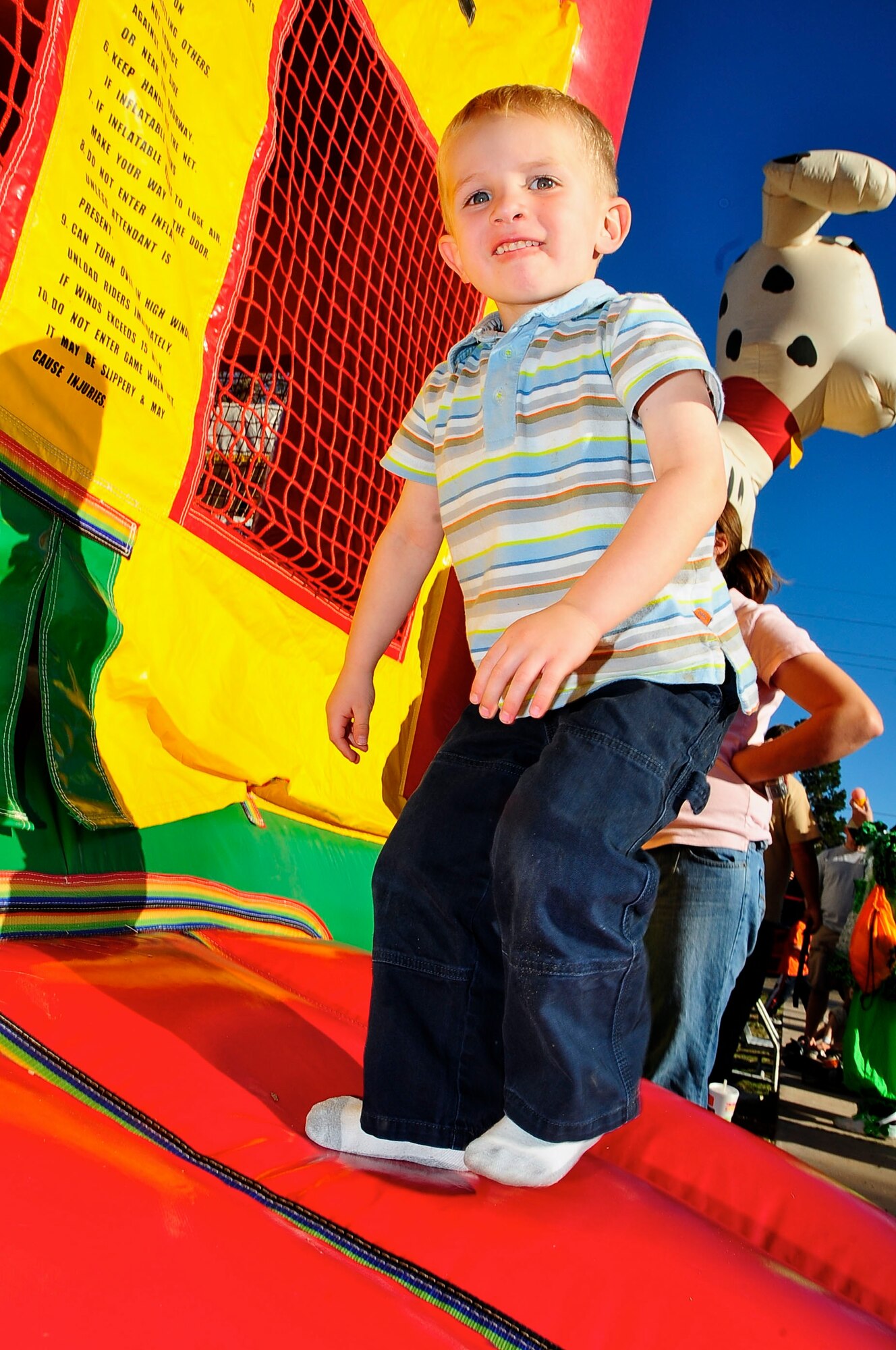 HOLLOMAN AIR FORCE BASE, N.M. -- A.J. Jaworski, 3 -- son of Tech. Sgt. Jason Jaworski, 4th Space Control Squadron, and Staff Sgt. Giana Jaworski, 49th Fighter Wing -- jumps on a bouncing castle during the fall festival at Steinhoff Park here Oct. 23. Activities for children at the fall-themed event included hayrides, face and pumpkin painting and games. More than 400 Team Holloman members attended. (U.S. Air Force photo by Tech. Sgt. Chris Flahive)
